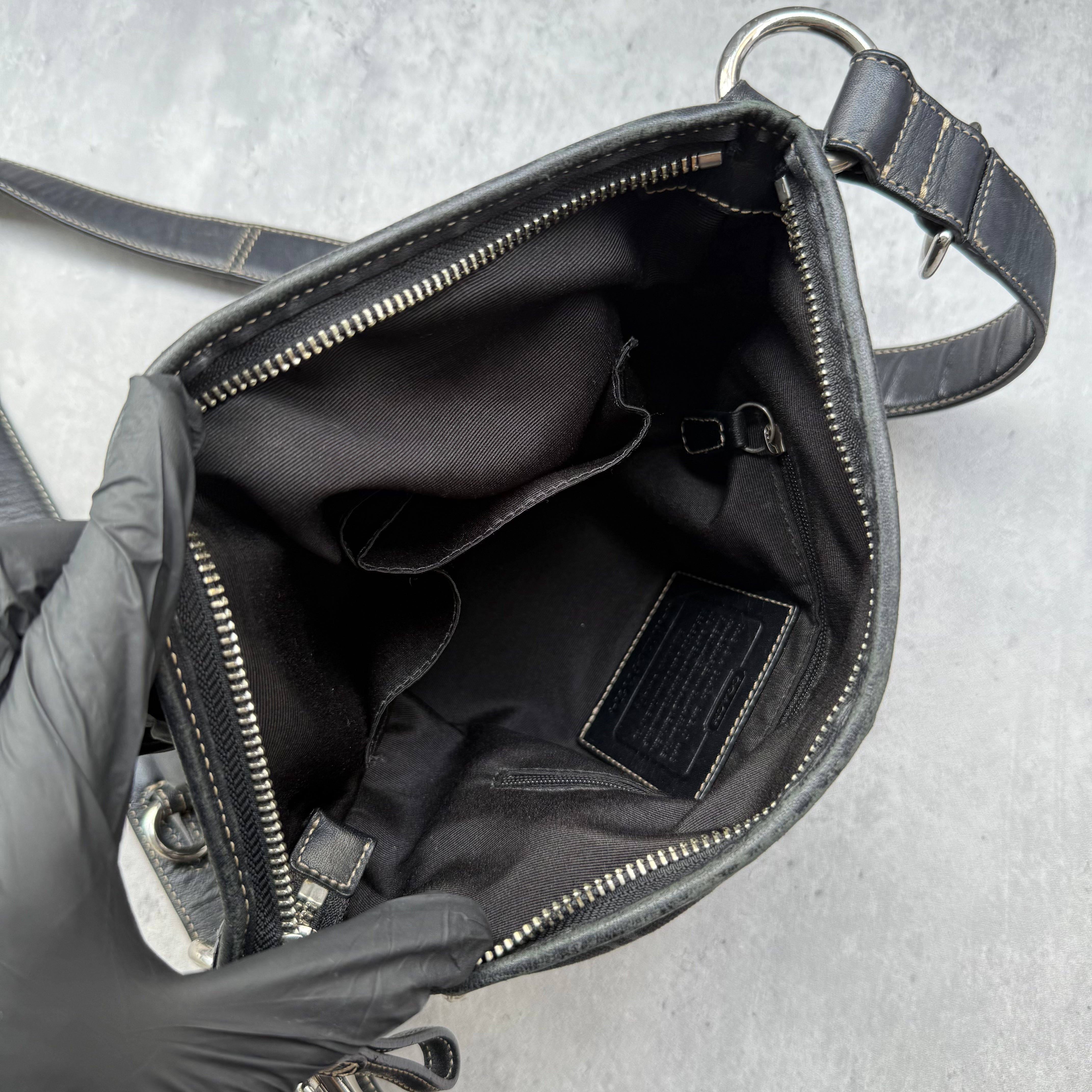 Coach Signature Canvas Crossbody Bag Black with leather trim, dual buckle detail, and silver-tone hardware