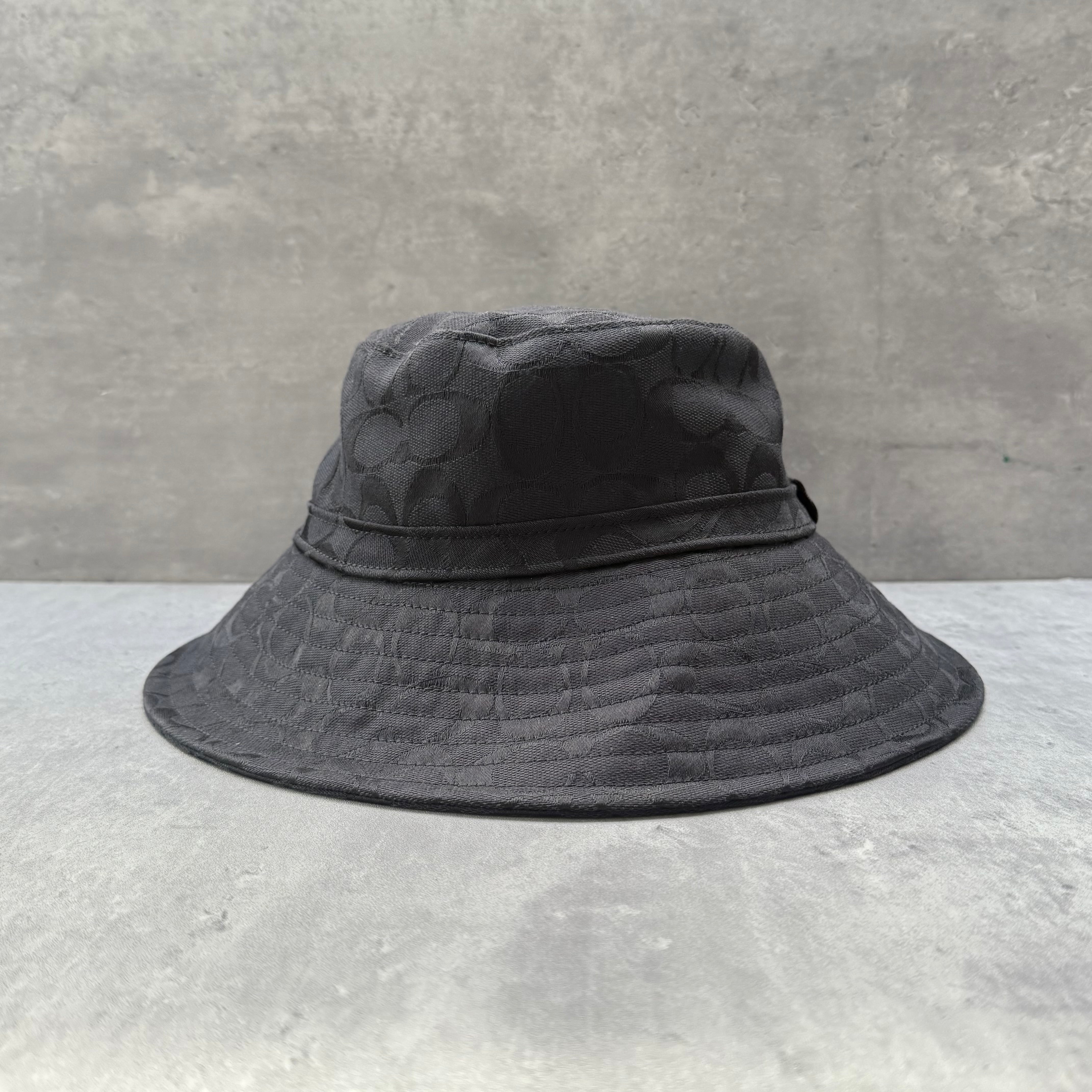 Coach Signature Canvas Denim Bucket Hat in black, crafted from canvas with all-over monogram pattern.
