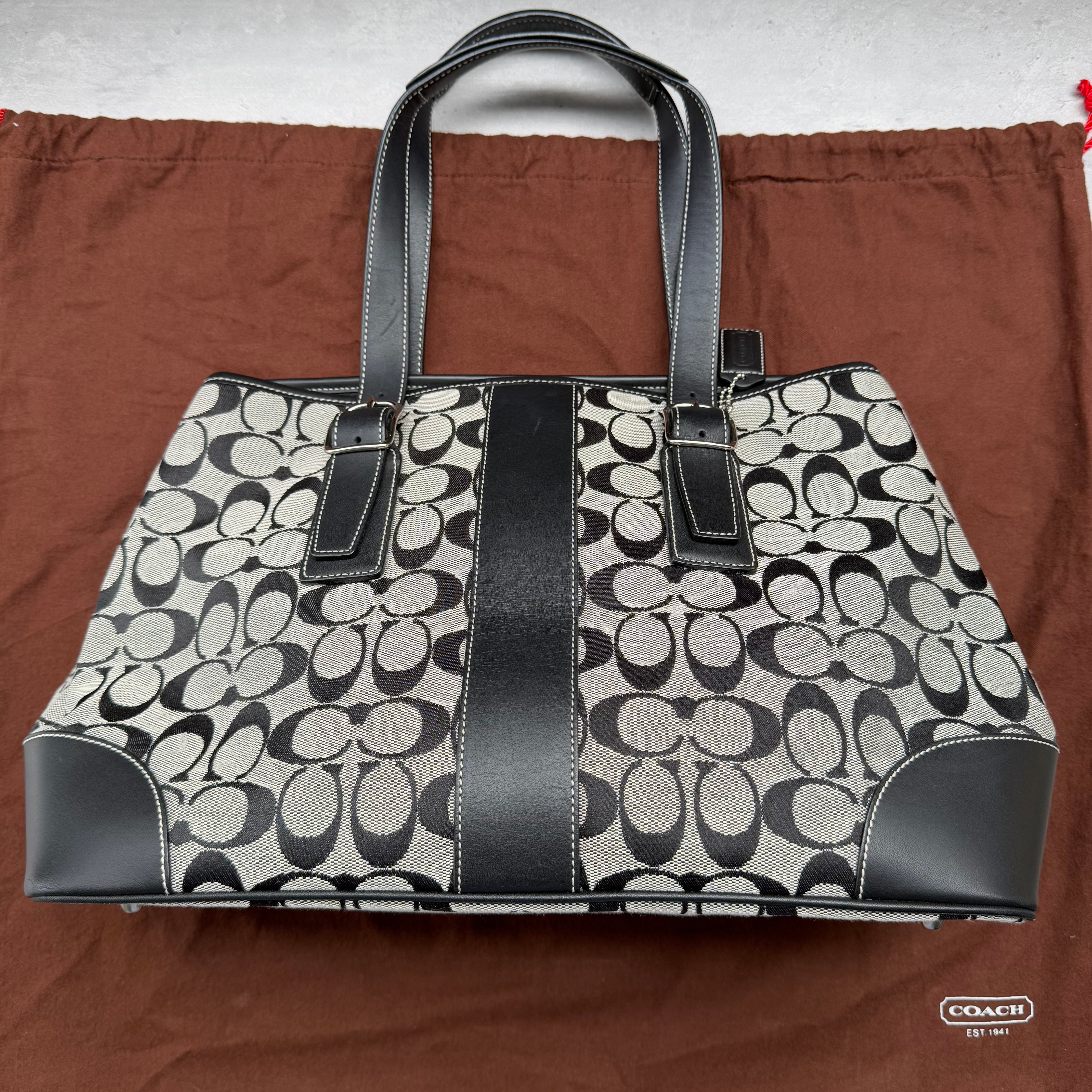 Coach Signature Canvas Tote Bag Grey/Black, featuring monogram canvas with black leather trim, dual handles, and spacious interior.