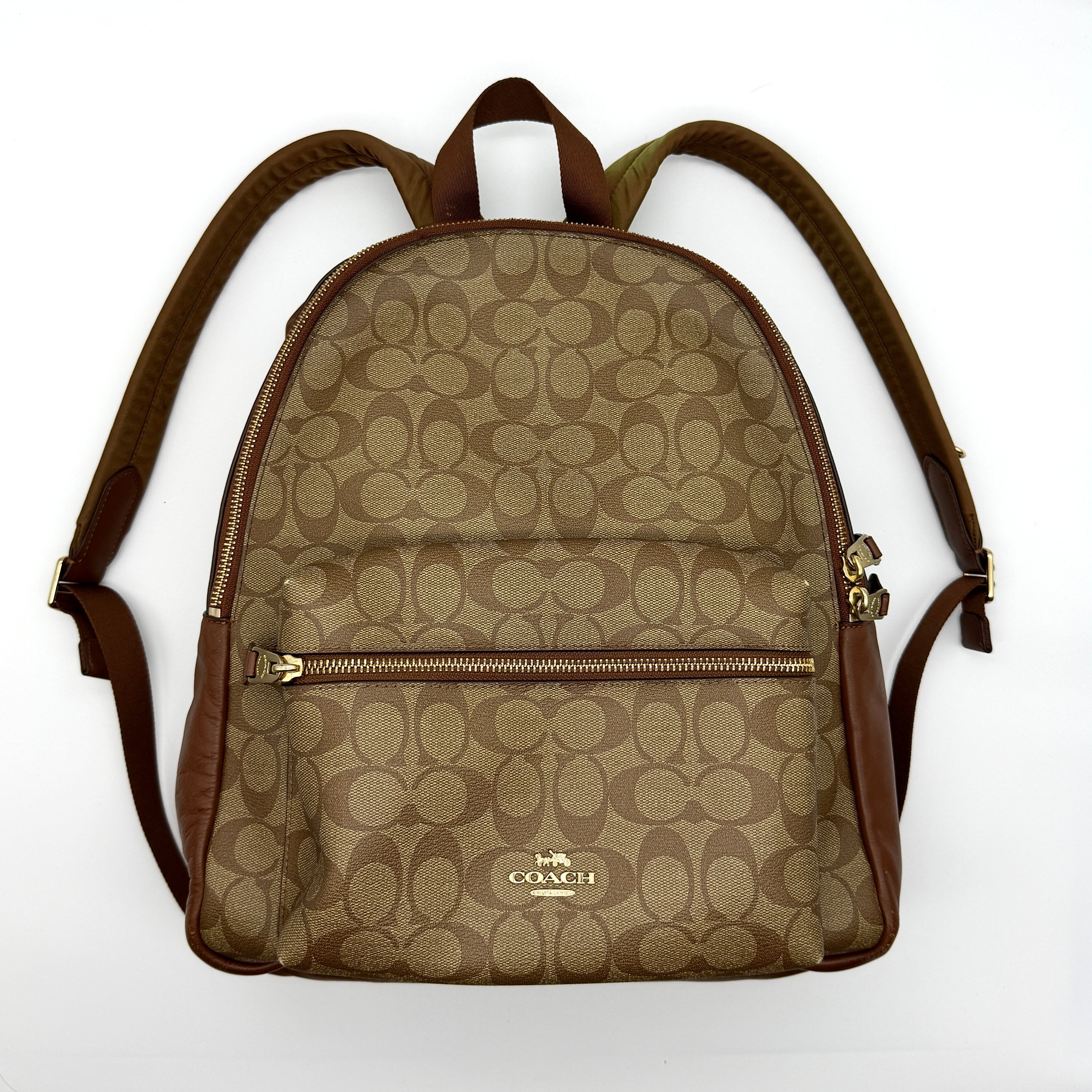 Coach Signature Charlie Backpack in beige and brown monogram coated canvas with gold-tone hardware and leather trim — pre-loved.