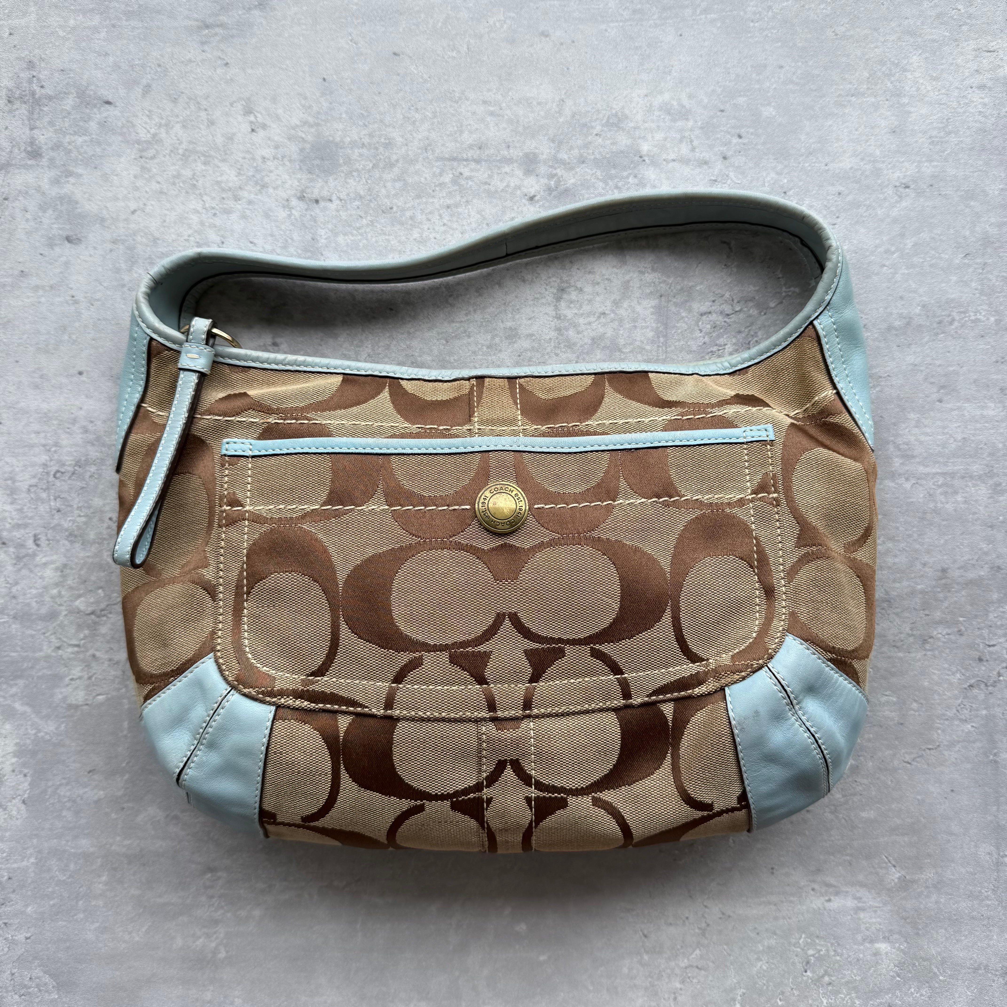 Coach Signature Ergo Hobo Shoulder Bag Beige/Blue, featuring monogram canvas with baby blue leather trim and a spacious zip-top interior.