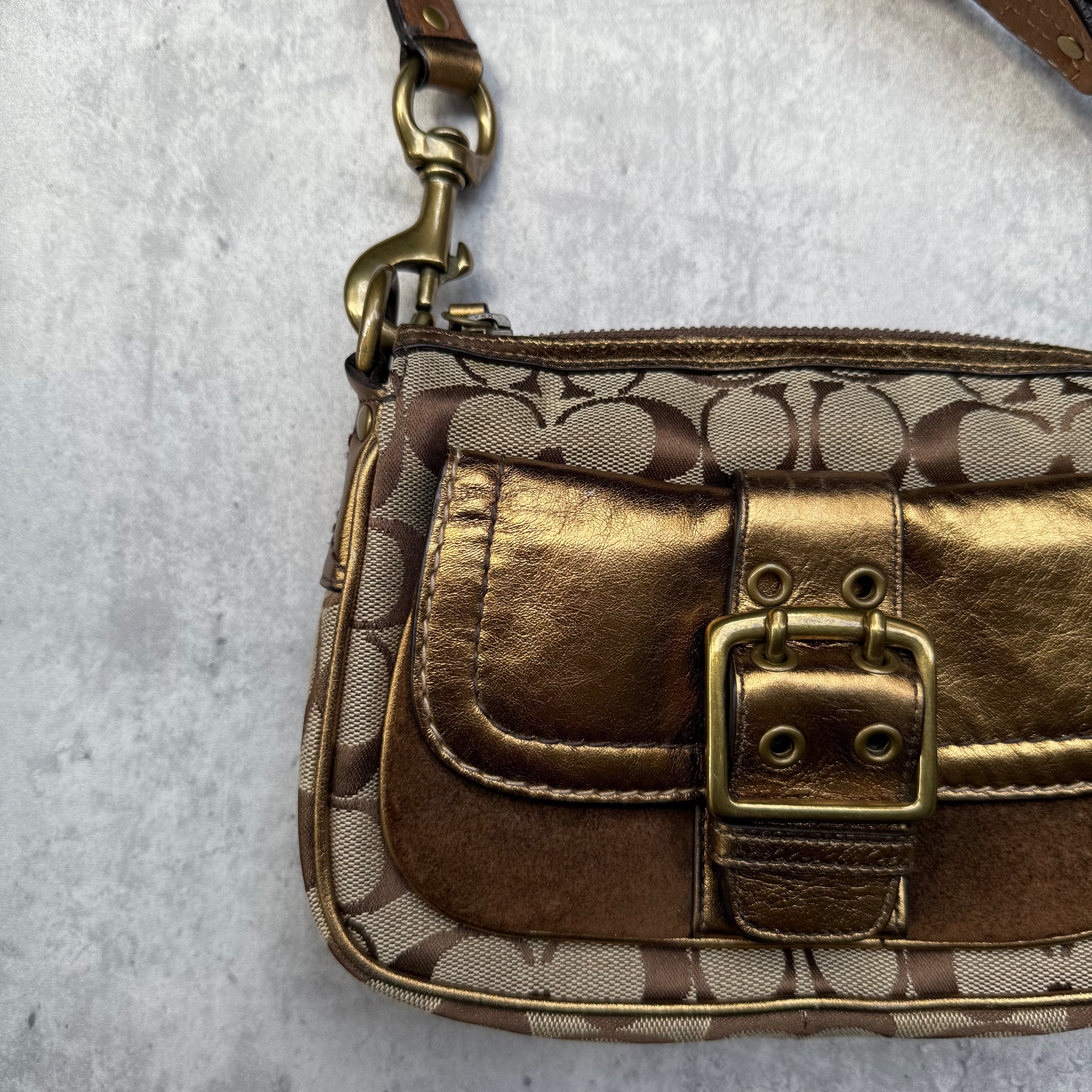 Coach Signature Shoulder Bag in beige canvas with gold metallic front buckle pocket, brown suede accents, and short strap.