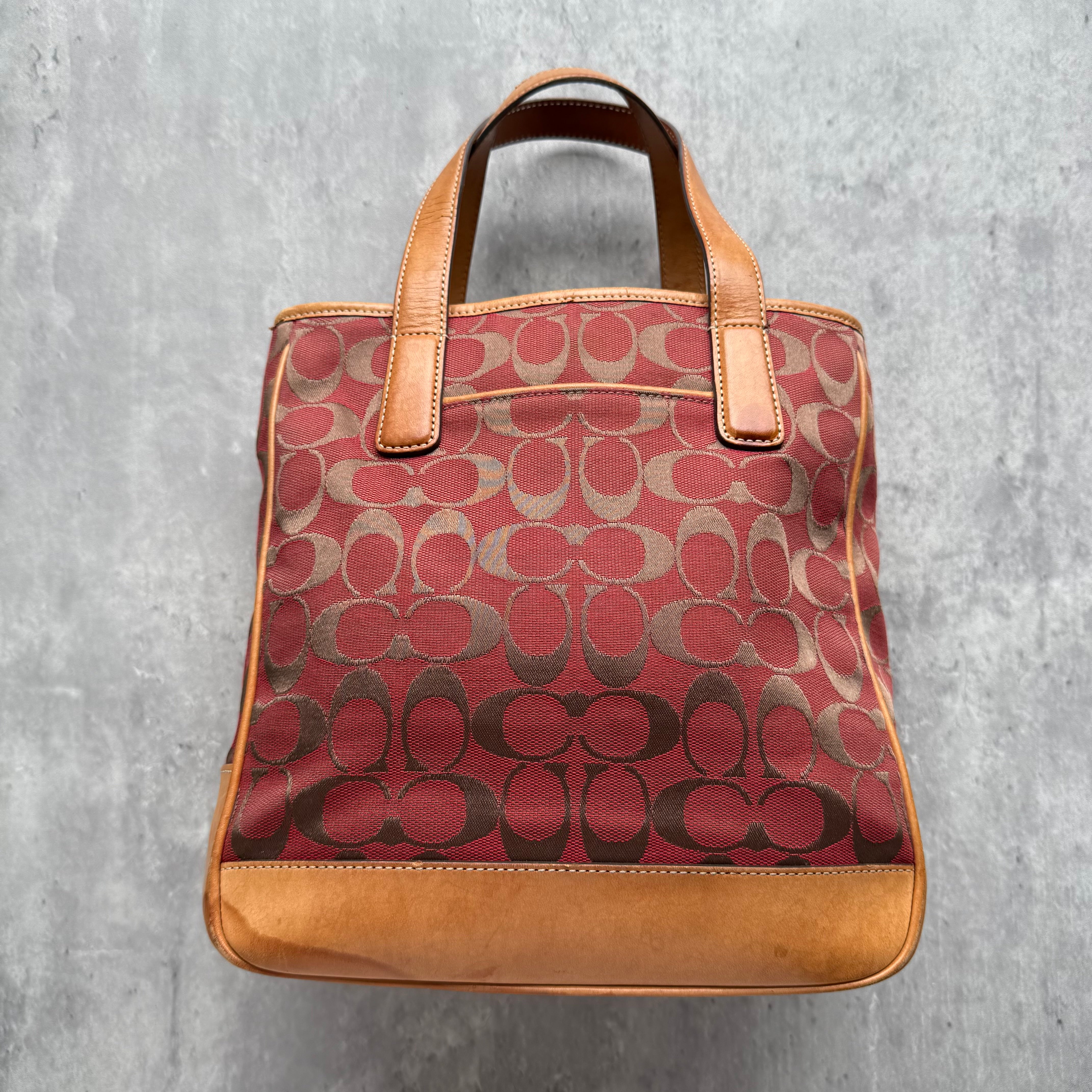 Coach Signature Hamptons Tote Bag Red/Tan in jacquard canvas with leather trim, featuring dual handles, central zip divider, and structured silhouette.