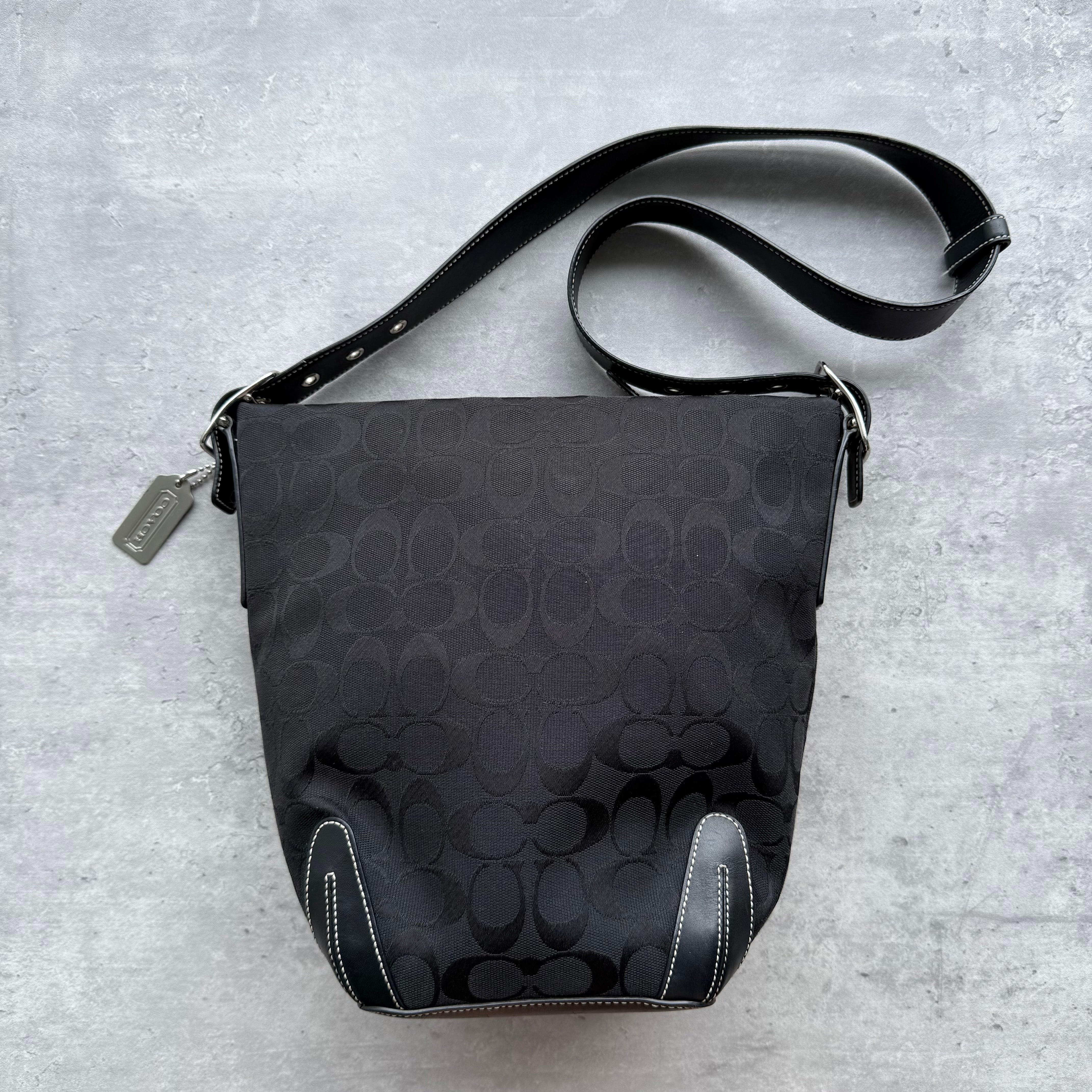 Coach Signature Hobo Bucket Shoulder Bag in black jacquard canvas with leather trim and contrast stitching, silver-tone hardware, and zip closure