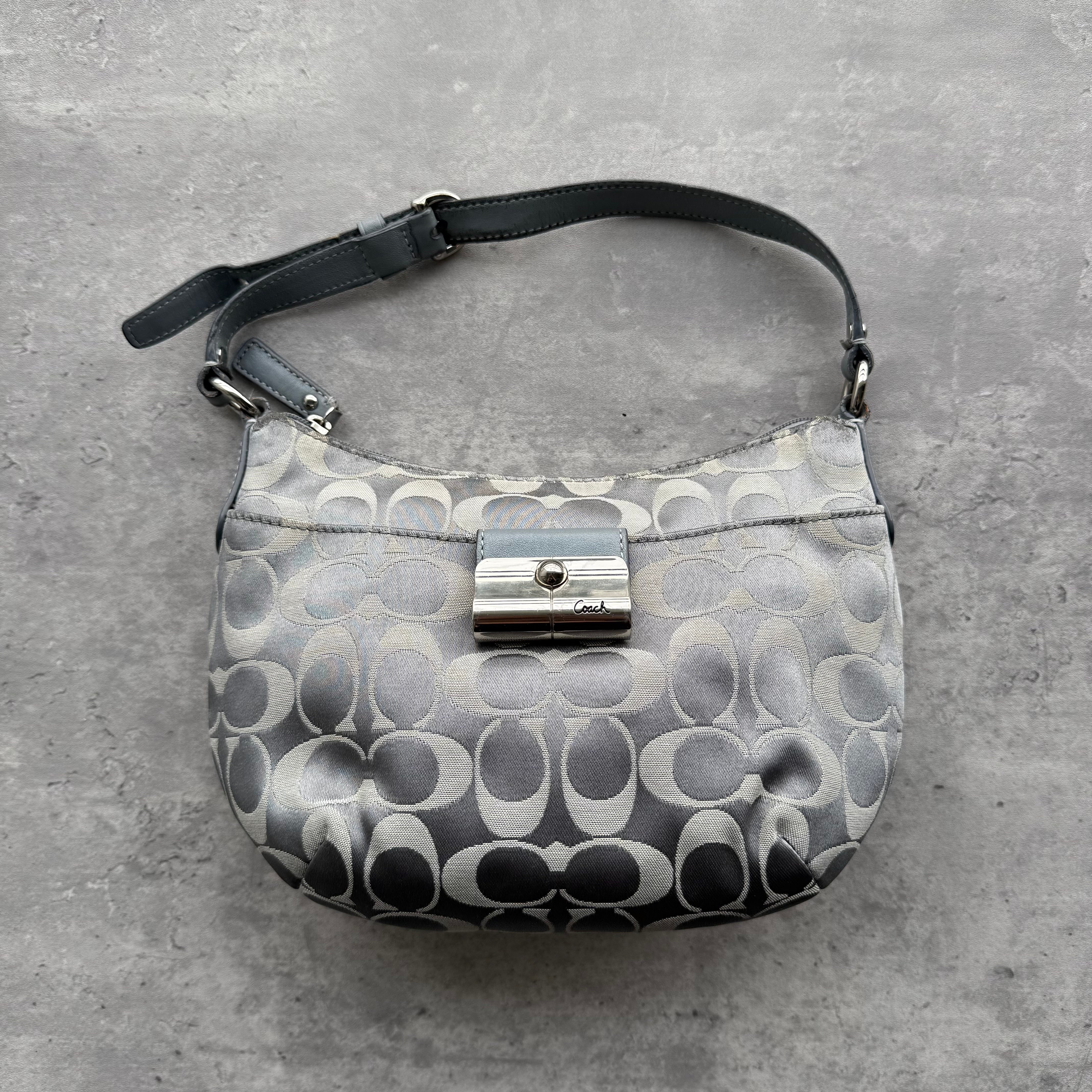 Coach Signature Kristin Hobo Shoulder Bag in silver jacquard with metallic leather trim and push-lock closure.