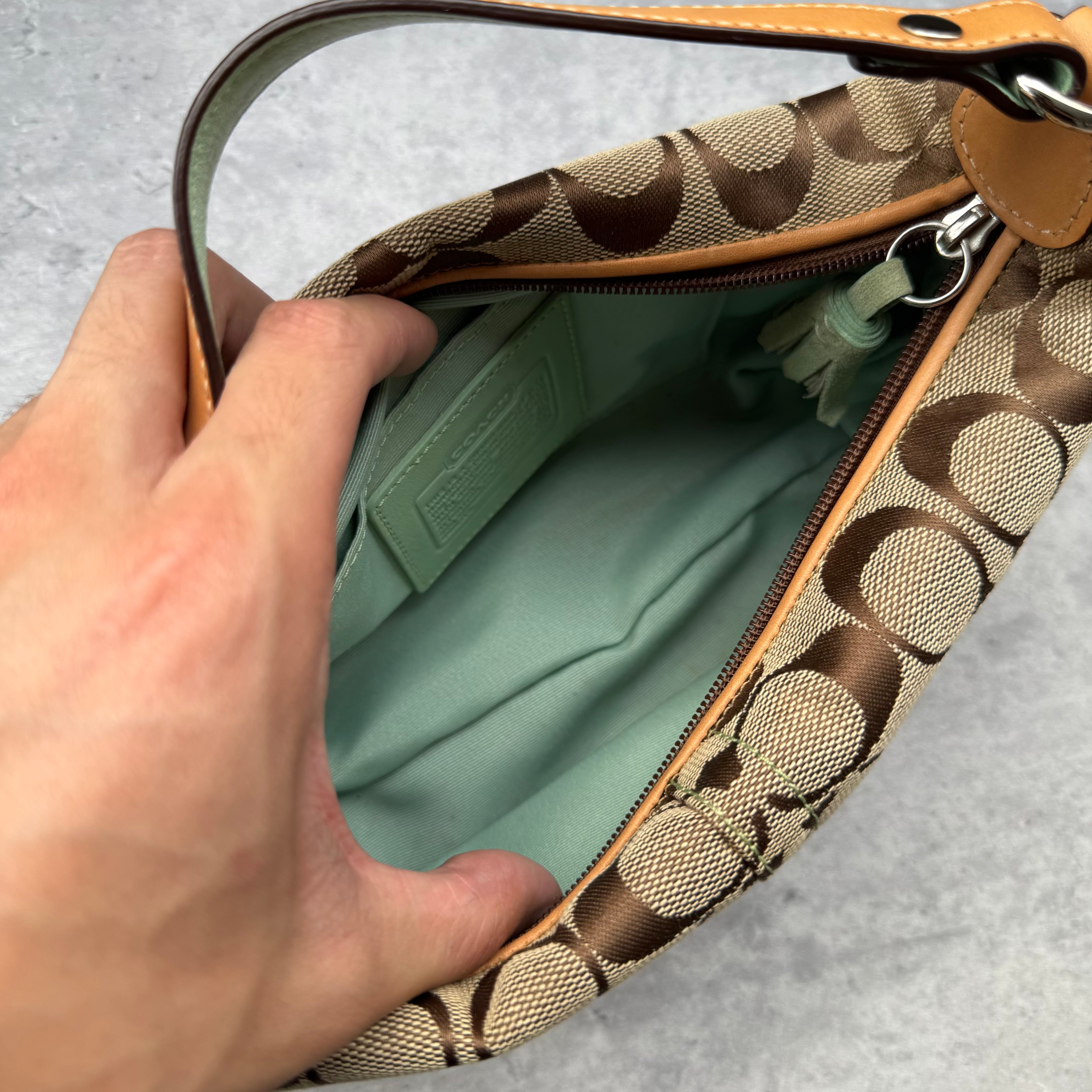 Coach Signature Mini Hobo Shoulder Bag in beige canvas with mint green suede trim and monogram design.