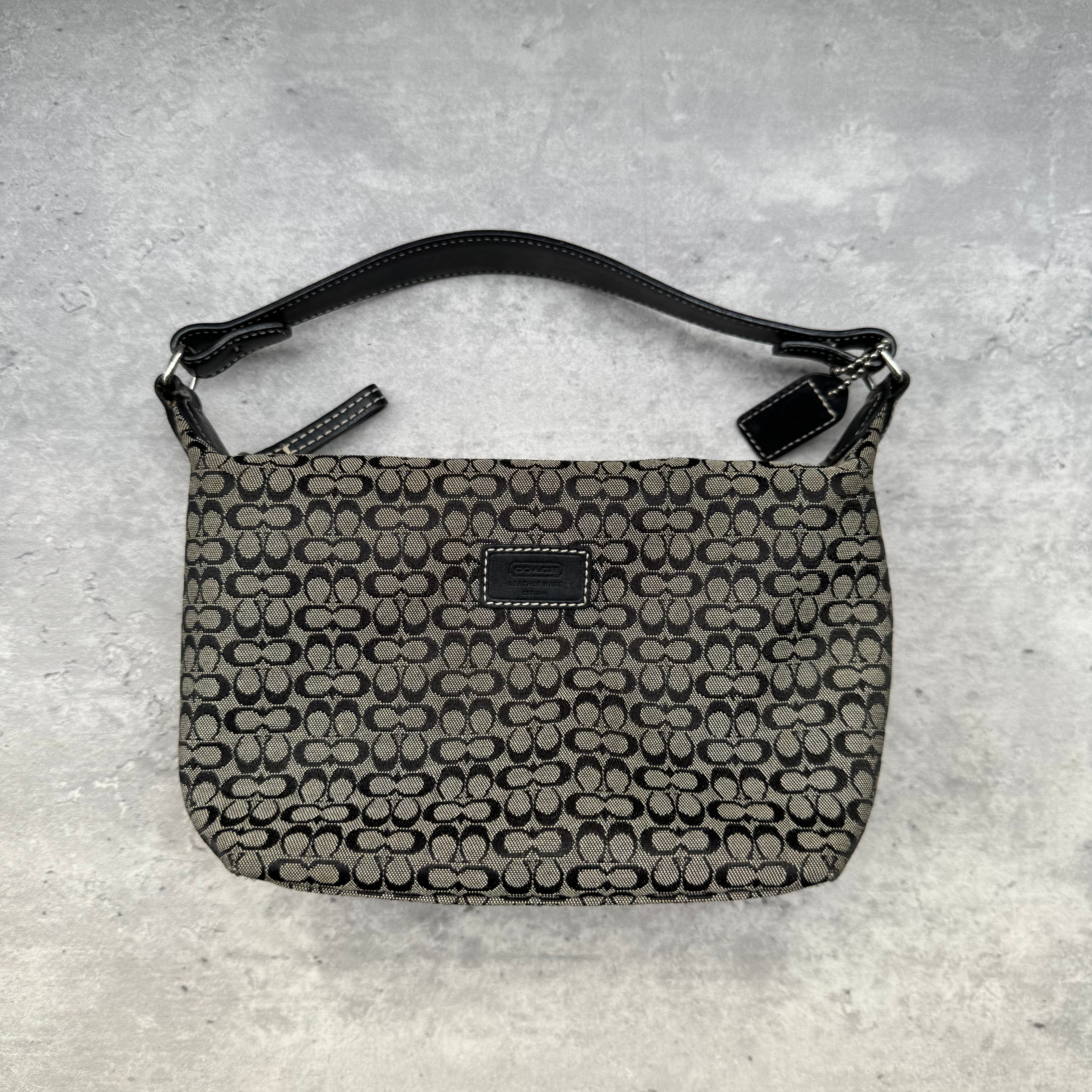 Coach Signature Mini Hobo Shoulder Bag in grey and black canvas with monogram print and black leather trim.