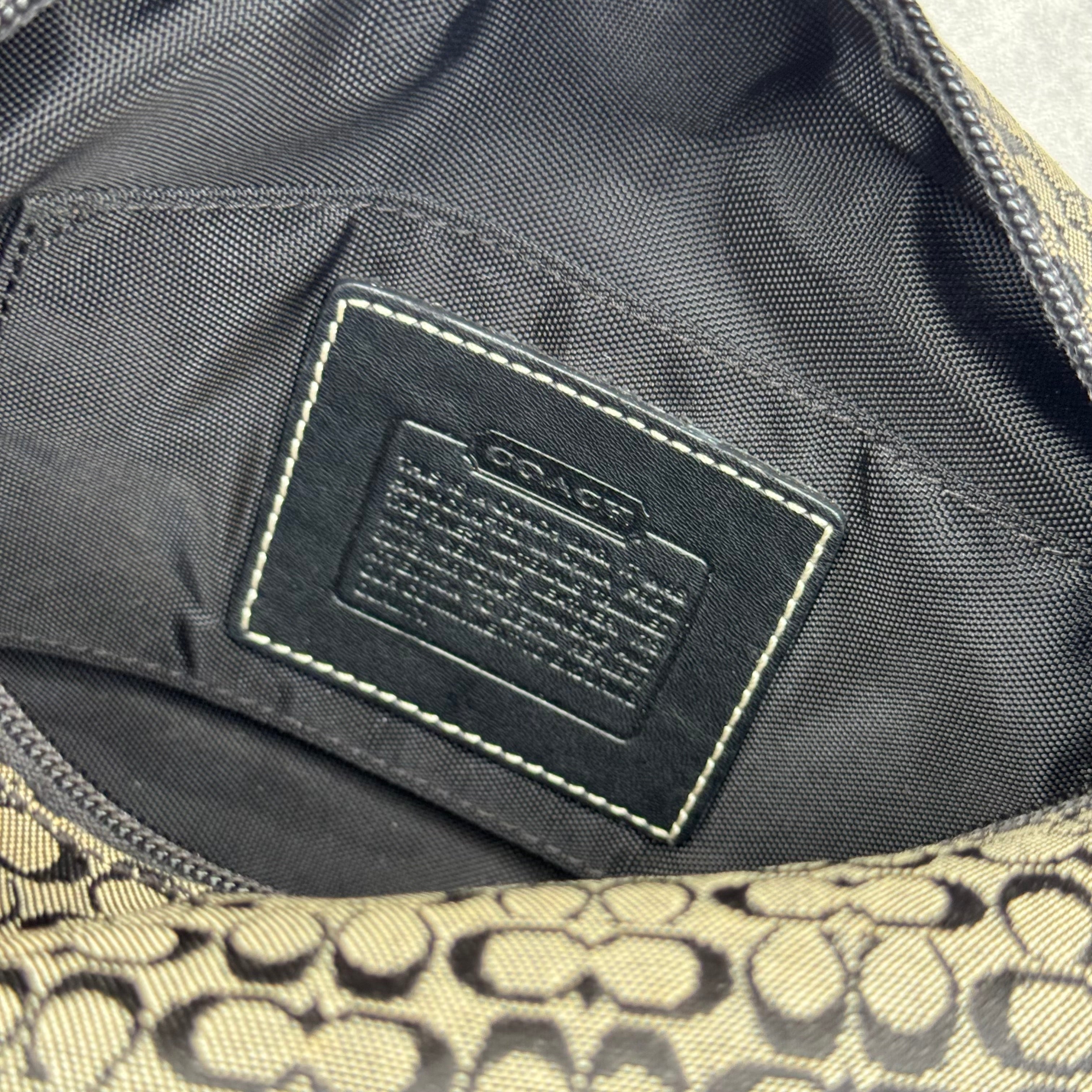 Coach Signature Mini Hobo Shoulder Bag in grey and black canvas with monogram print and black leather trim.