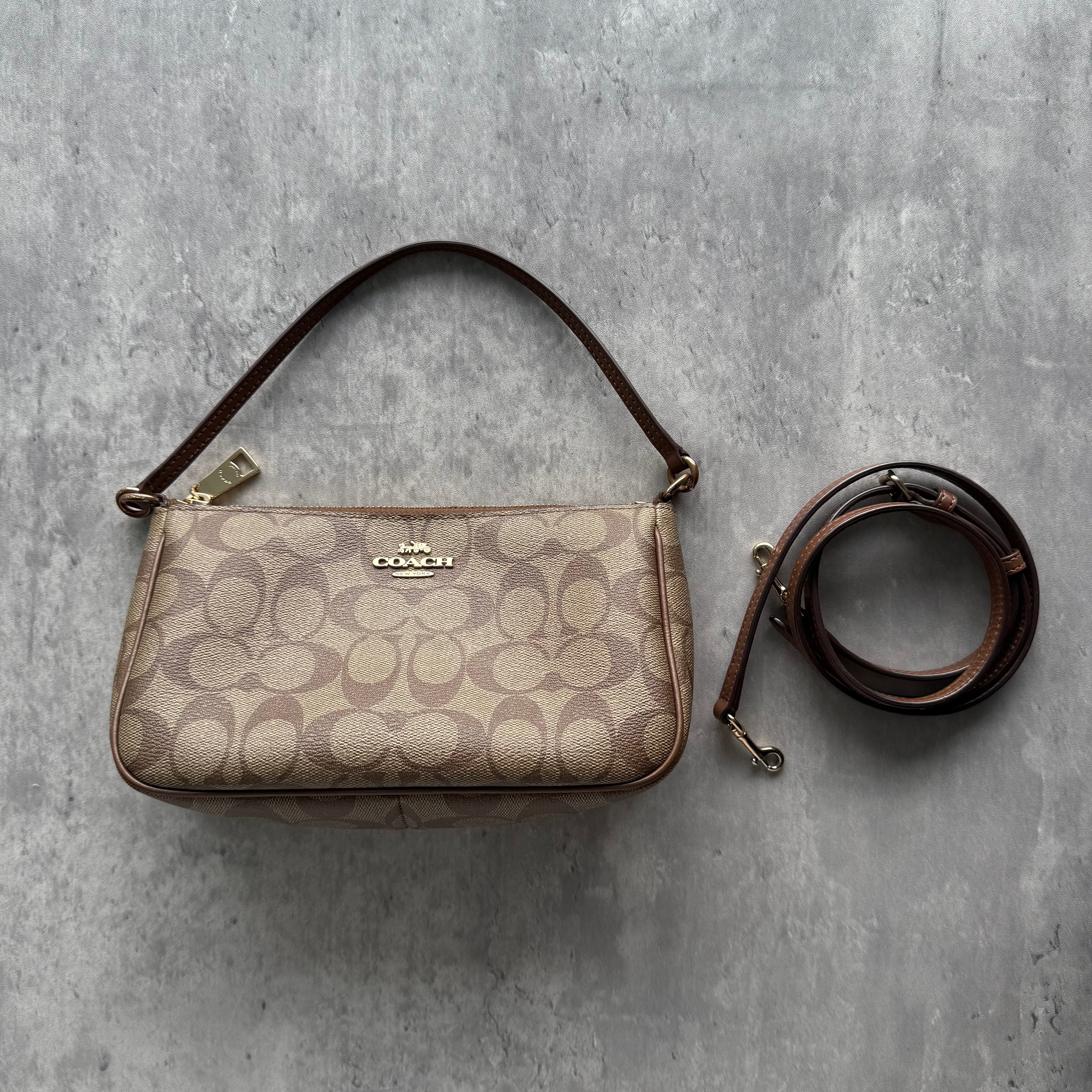 Coach Signature Shoulder Bag in beige monogram canvas with gold-tone hardware and dual strap options