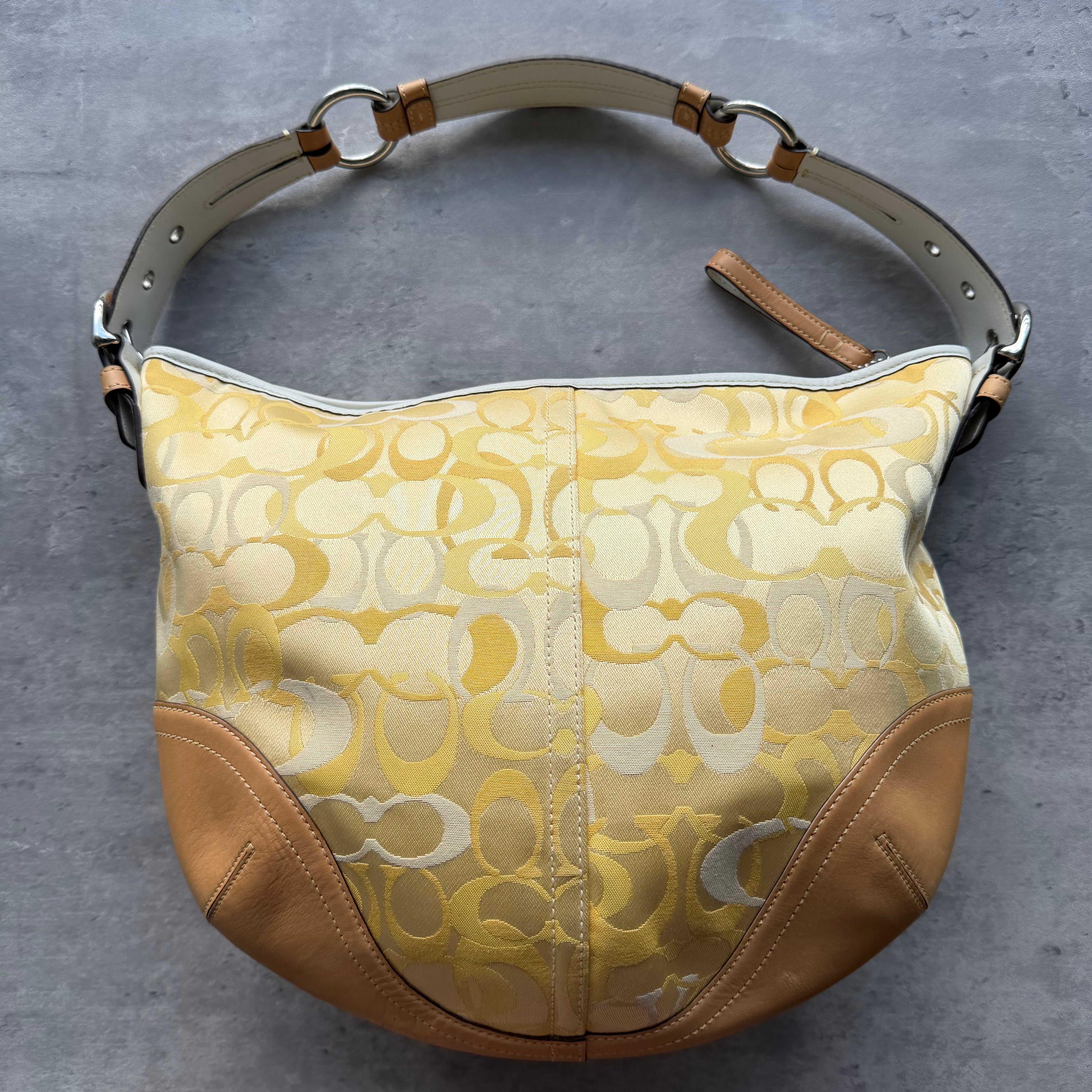 Coach Signature Soho Mini Hobo Shoulder Bag in yellow jacquard canvas with beige leather trim and silver-tone hardware.