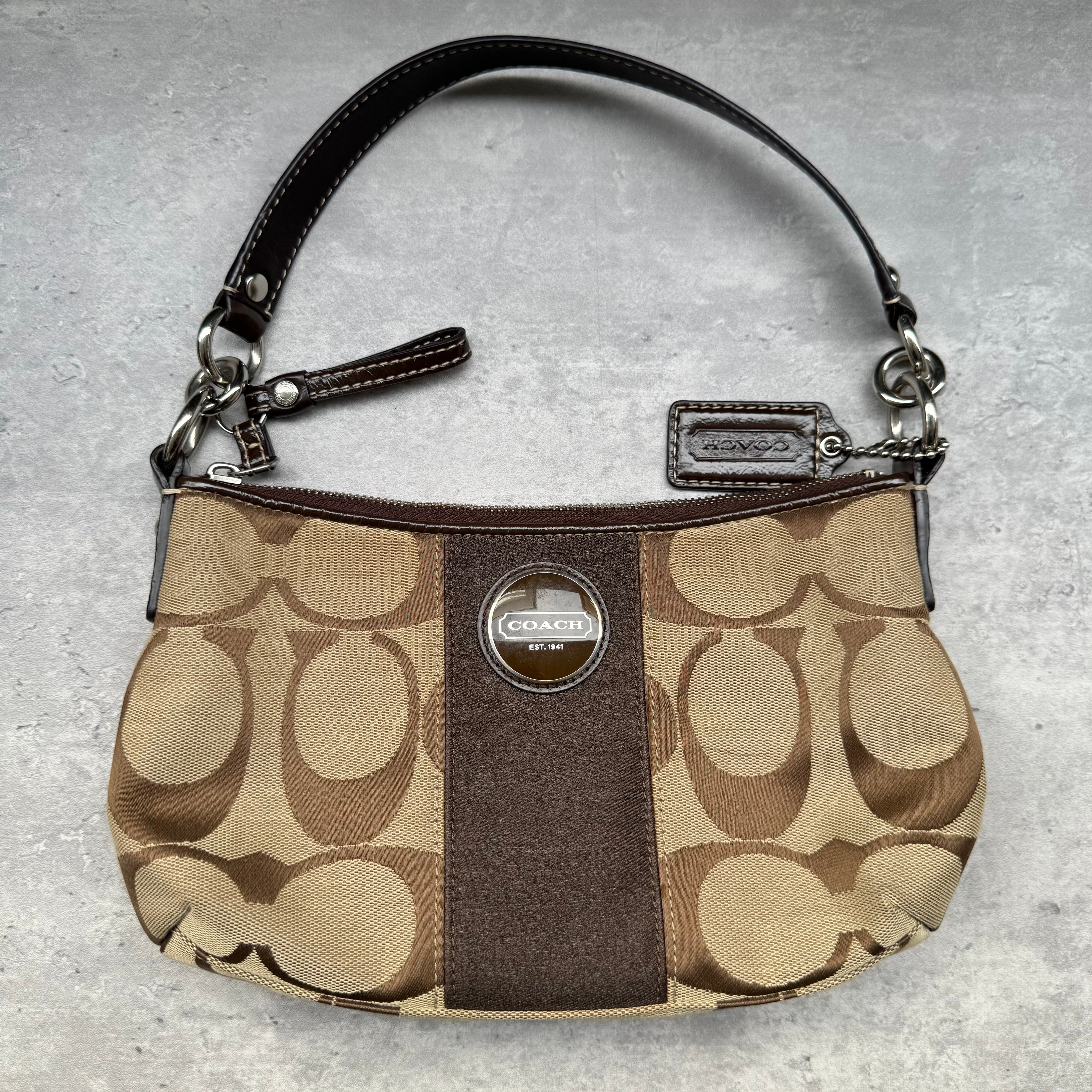 Coach Signature Stripe Shoulder Bag in beige and brown monogram canvas with dark brown leather trim and detachable strap.