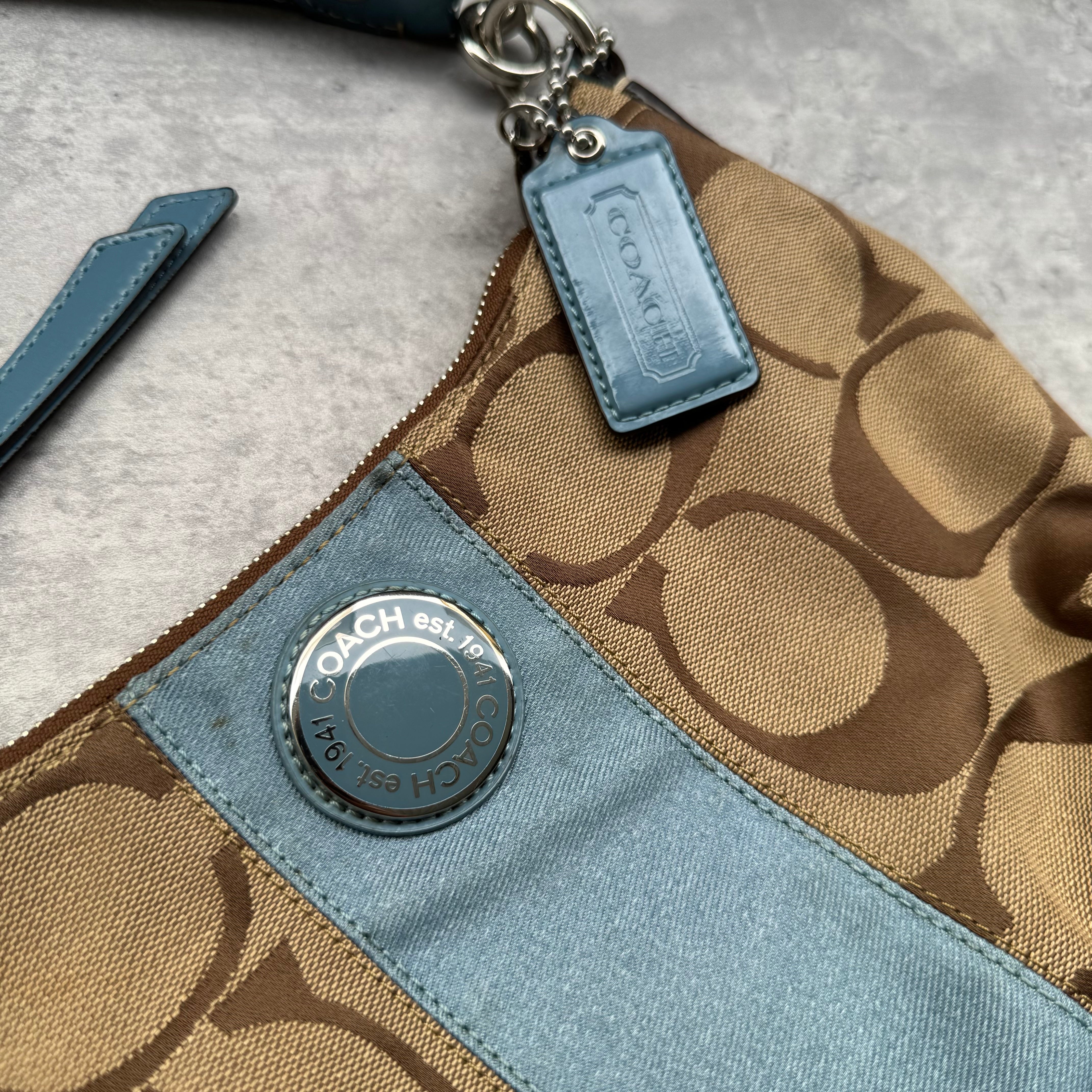 Coach Signature Stripe Shoulder Bag in brown canvas with blue leather trim and vertical logo stripe.