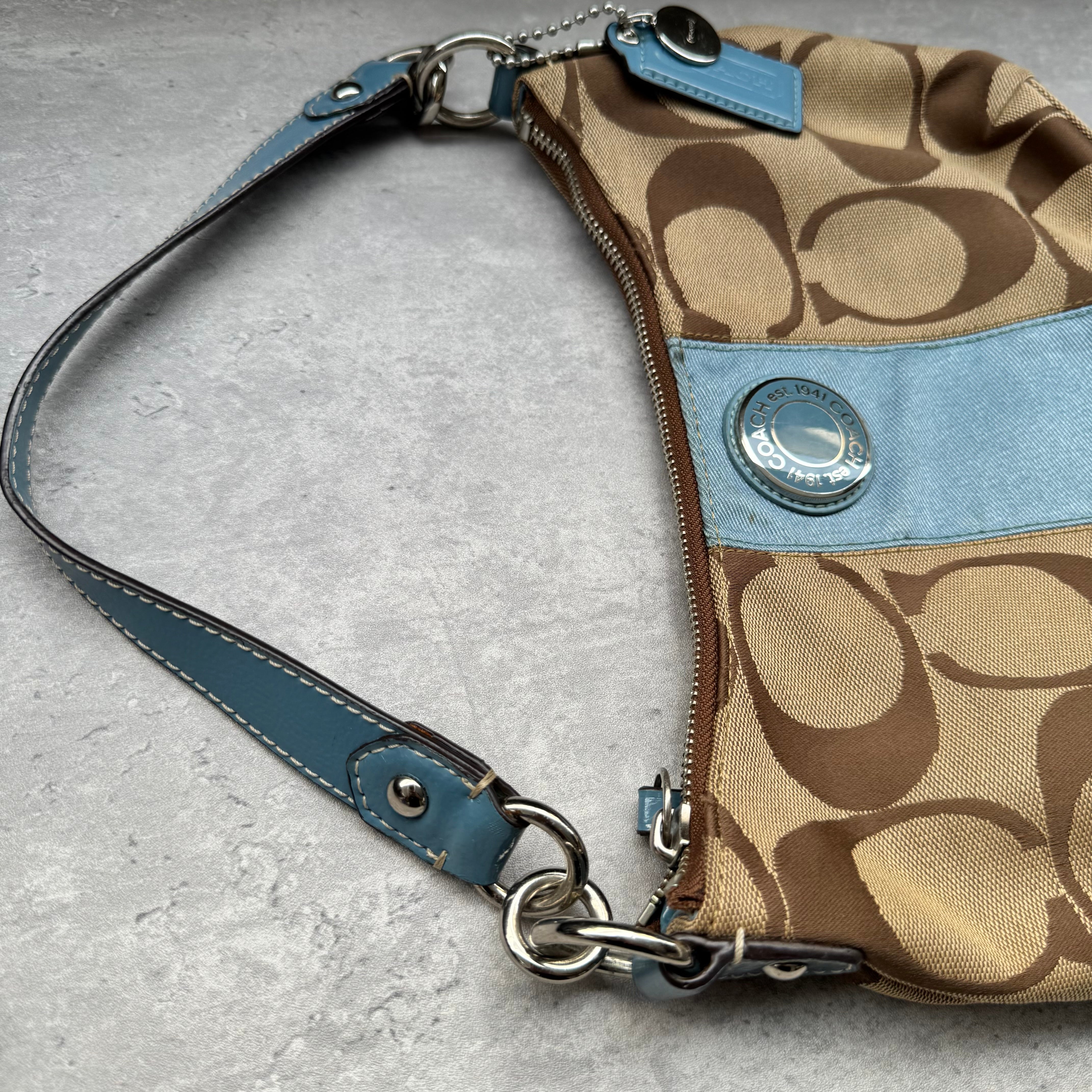 Coach Signature Stripe Shoulder Bag in brown canvas with blue leather trim and vertical logo stripe.