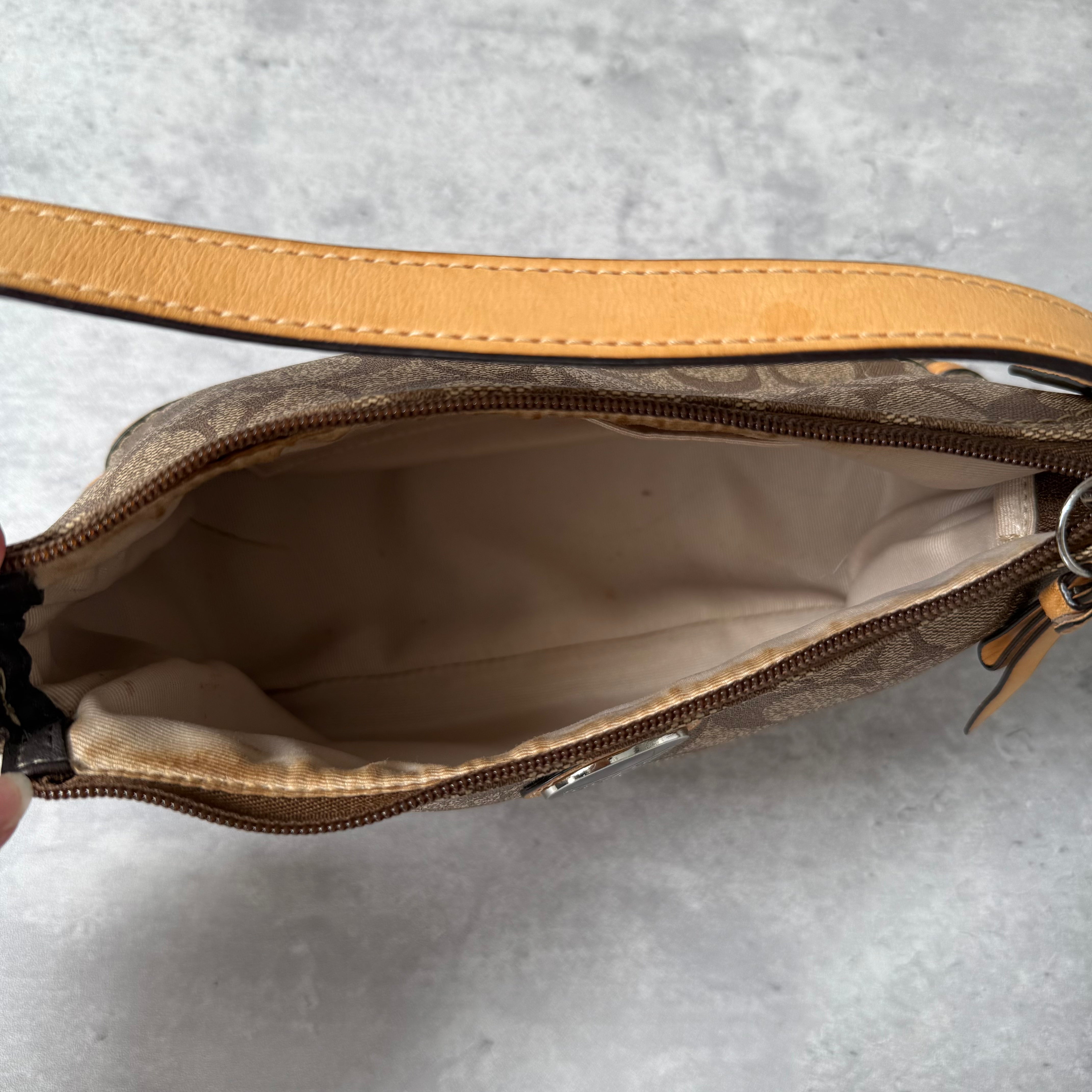 Coach Signature Sufflette Leather Shoulder Bag in beige with monogram canvas, tan leather trim, zip-top closure, and interior slip pocket