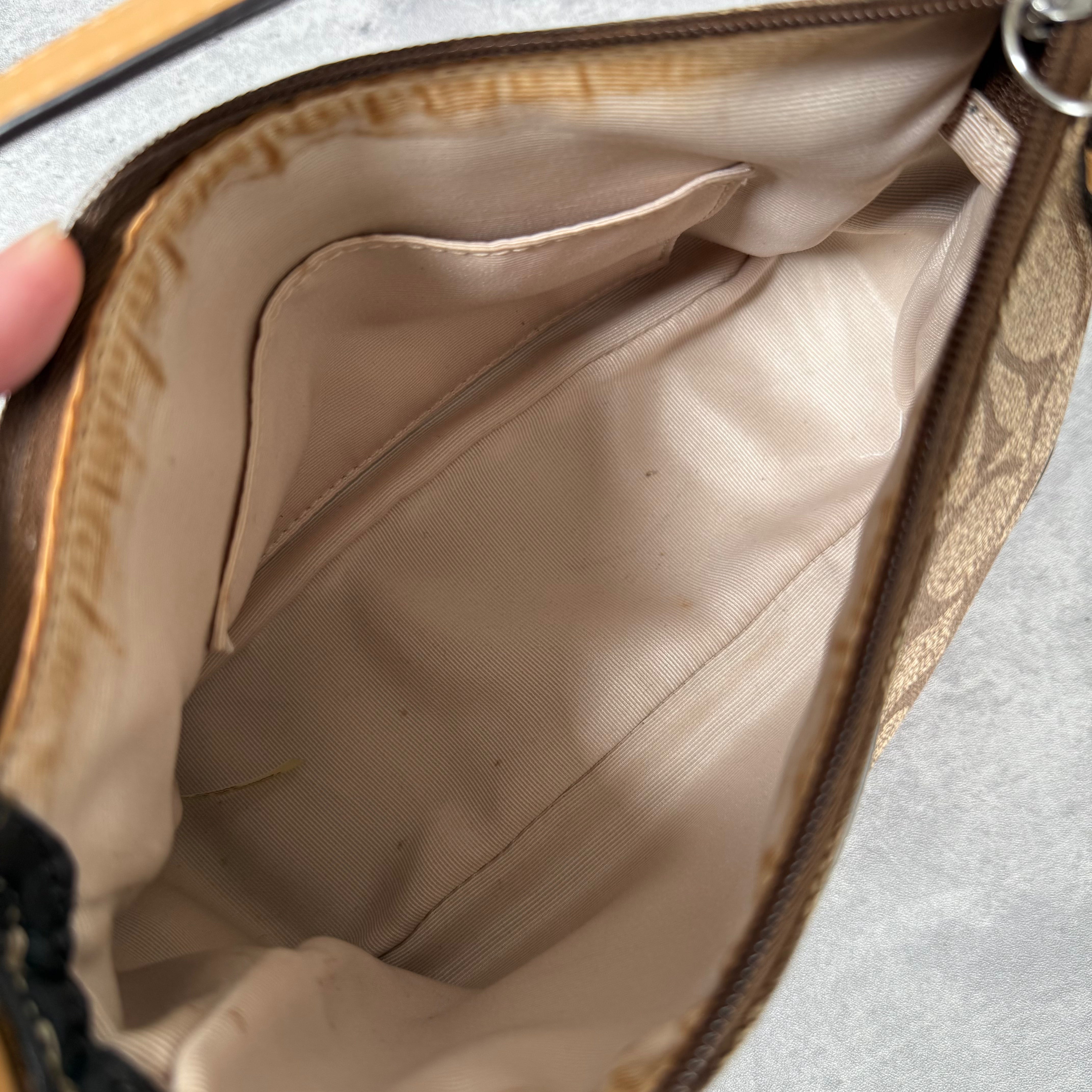 Coach Signature Sufflette Leather Shoulder Bag in beige with monogram canvas, tan leather trim, zip-top closure, and interior slip pocket