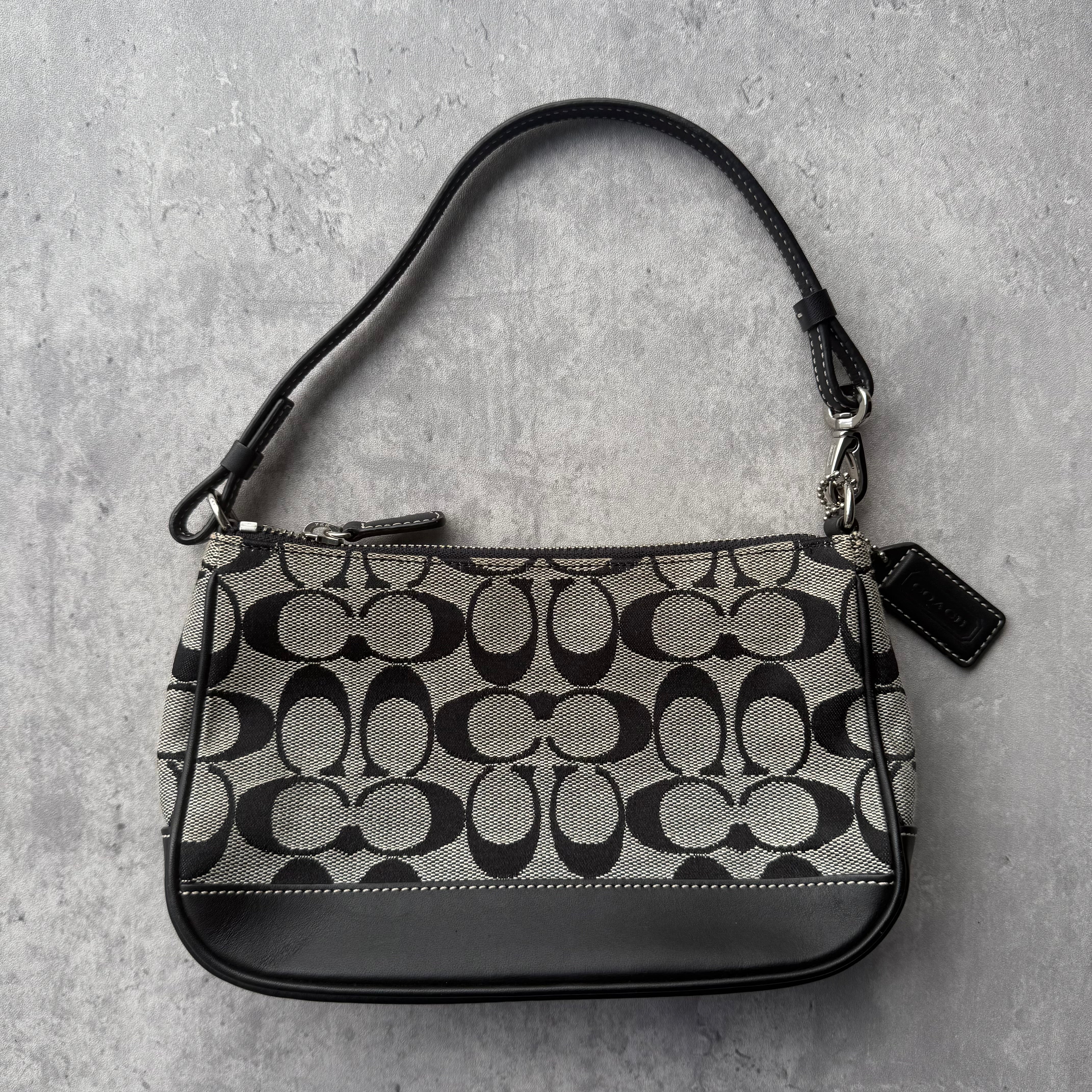 Coach Y2K Demi Shoulder Bag in grey and black monogram jacquard with black leather trim, silver-tone hardware, and single shoulder strap.