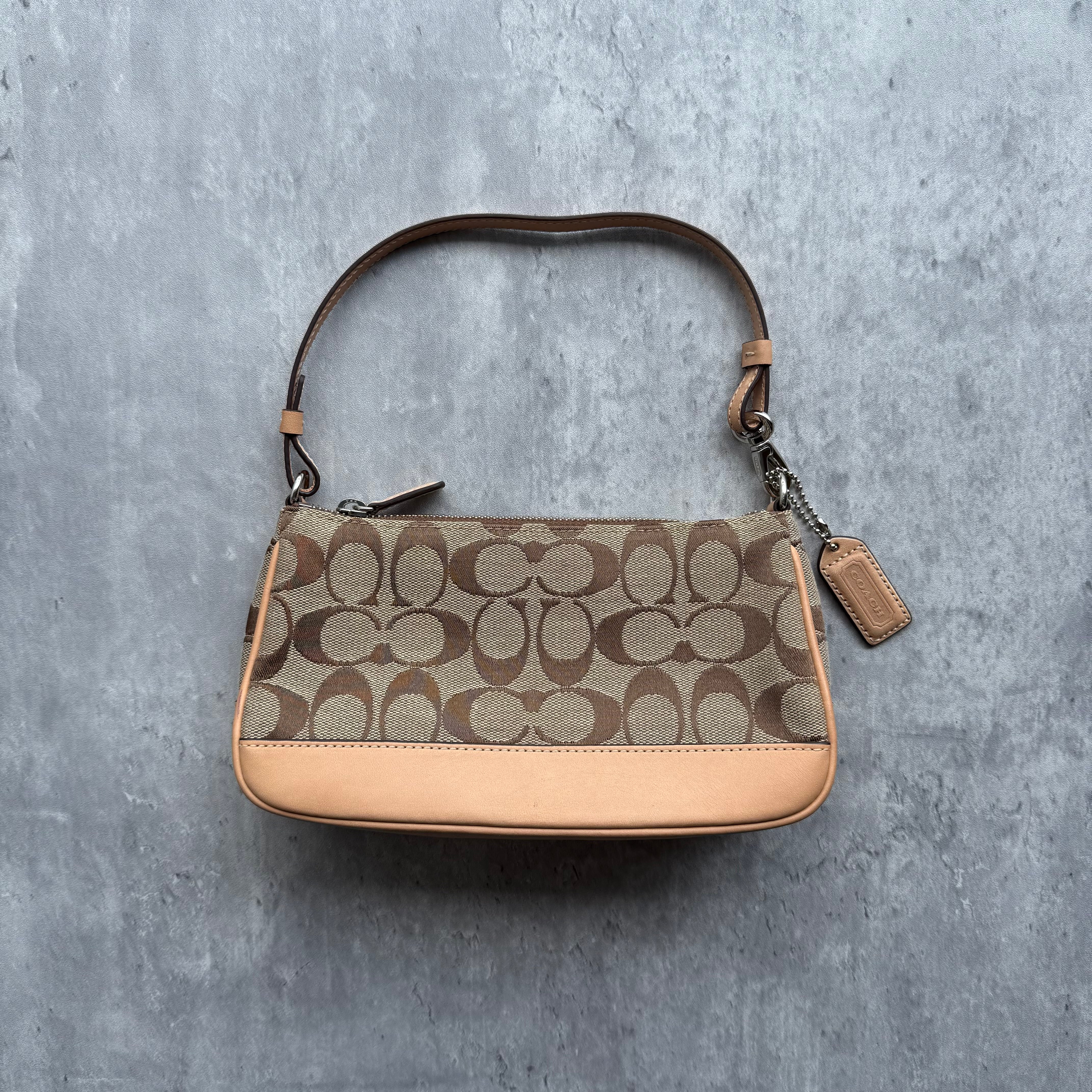Coach Y2K Demi Shoulder Bag in tan monogram canvas with smooth leather trim, zip closure, and orange interior lining.
