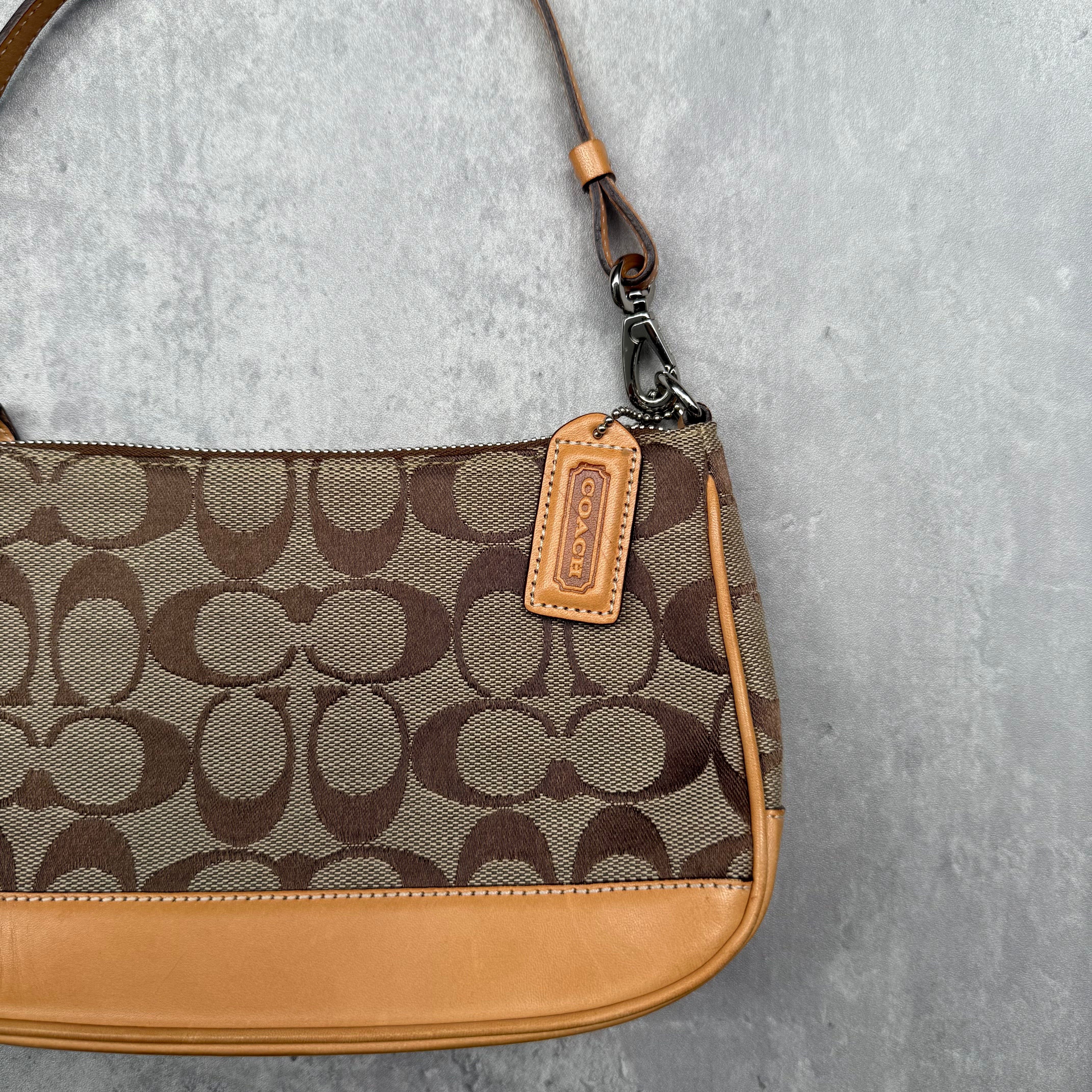 Coach Y2K Demi Shoulder Bag Tan, featuring signature monogram canvas, tan leather trim, and orange fabric interior with silver-tone hardware.