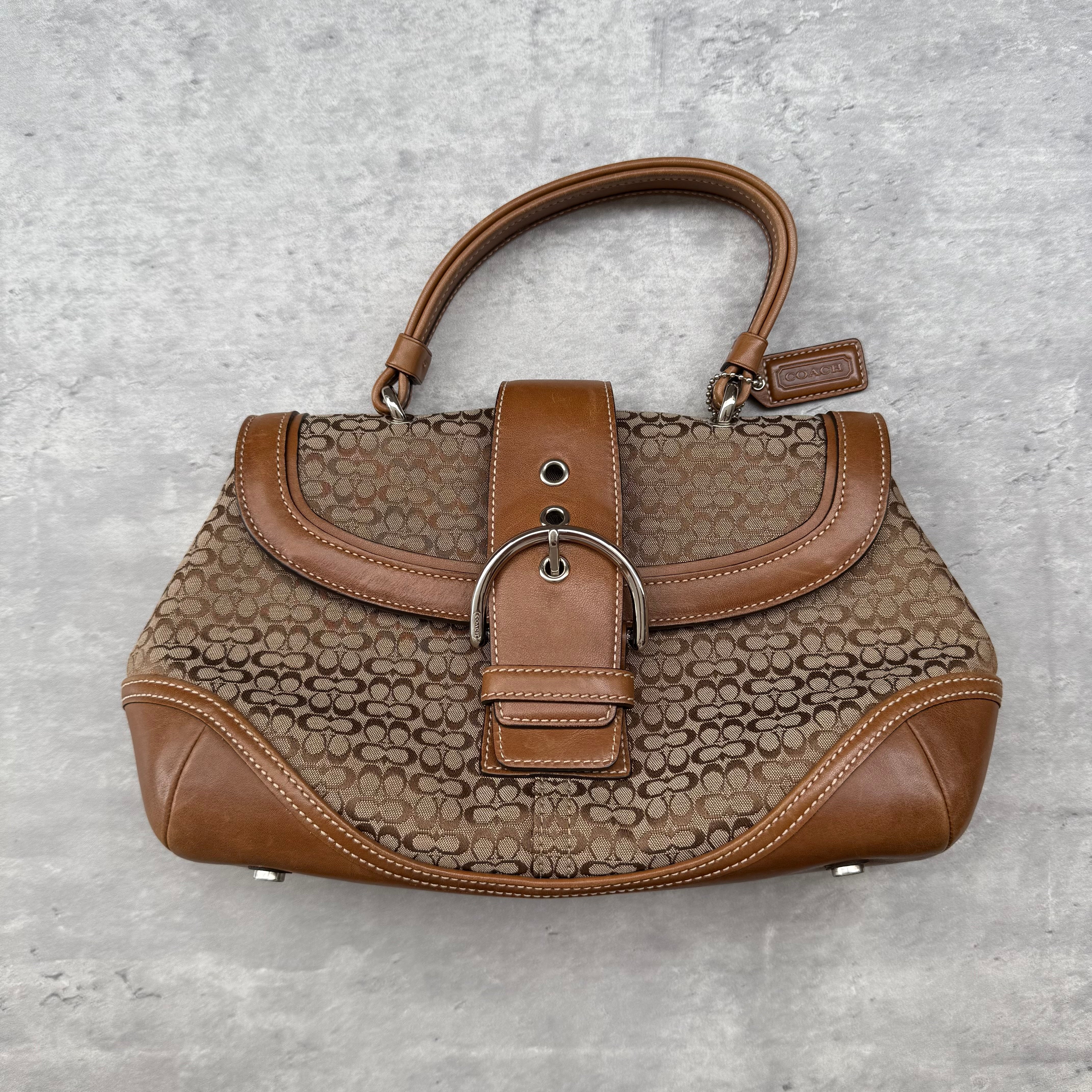 Coach Y2K Soho Shoulder Bag in tan signature monogram canvas with leather trim and silver-tone buckle strap
