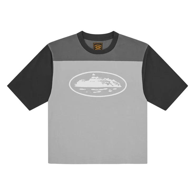 Corteiz Alcatraz Heavyweight Varsity Jersey in Grey, featuring contrast sleeves and reflective Alcatraz logo on the front.