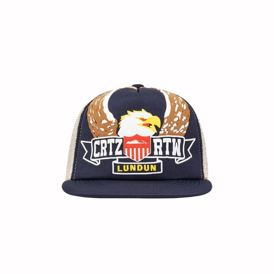 Corteiz Dipset Trucker Hat in navy with bold eagle crest, CRTZ RTW LUNDUN text, and beige mesh back.