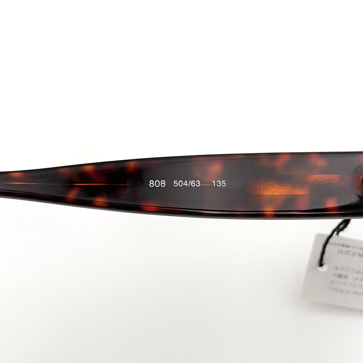 Bvlgari 808 sunglasses in tortoiseshell brown acetate displayed with original case and cloth.