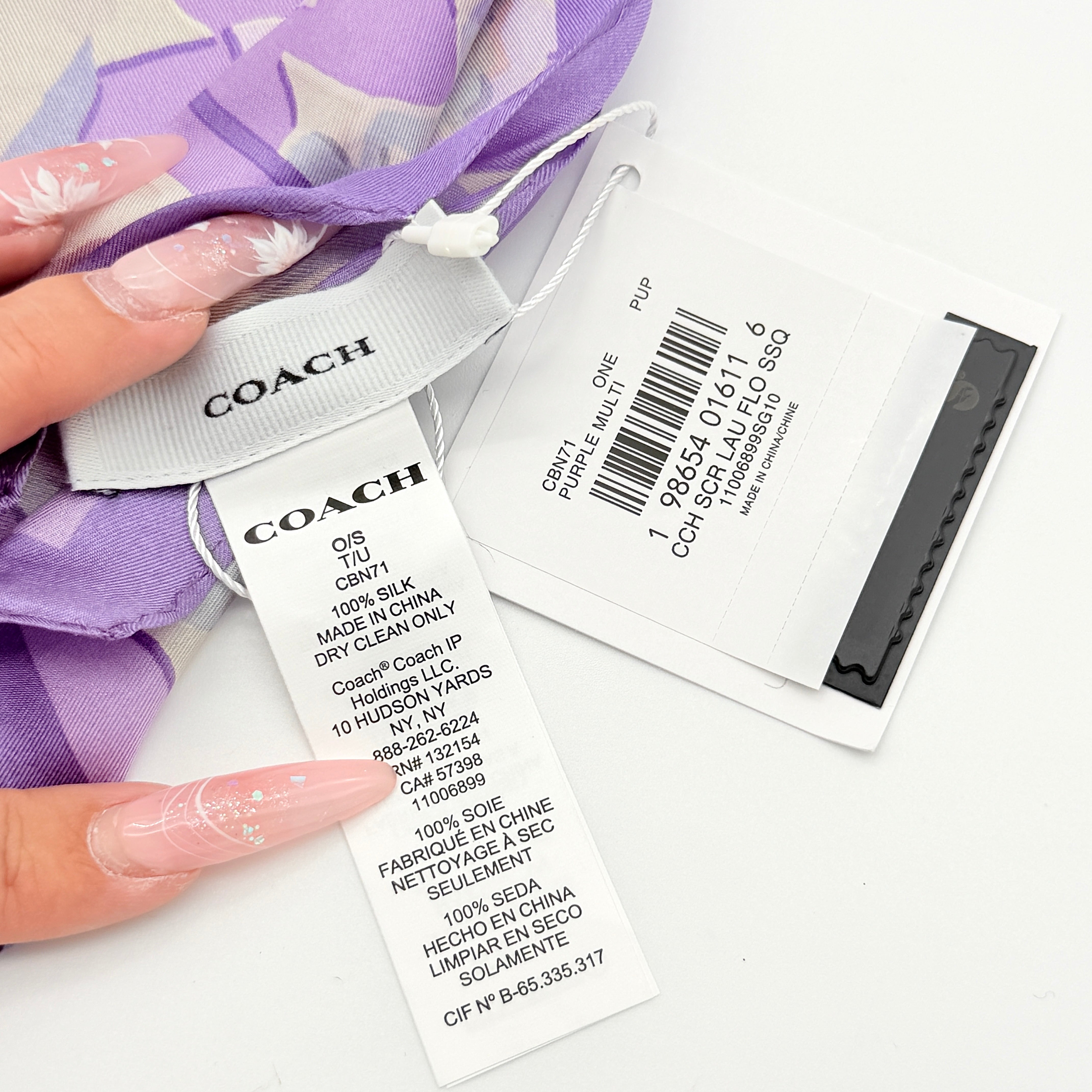 Coach floral silk scarf in purple with logo, presented with original packaging and tags.