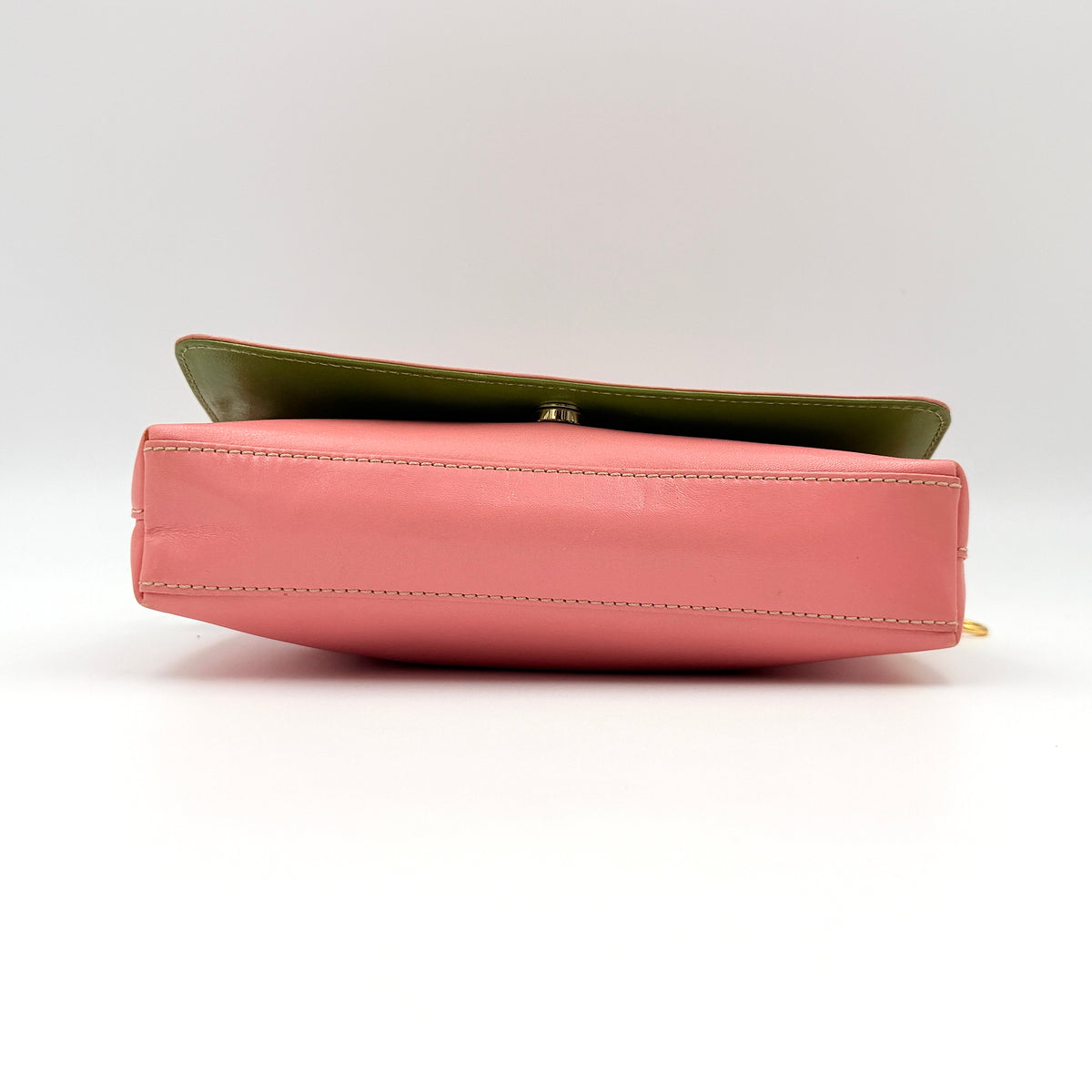 Kate Spade Morgan East West Shoulder Bag in smooth pink leather with gold-tone hardware and a green interior, displayed on white background.