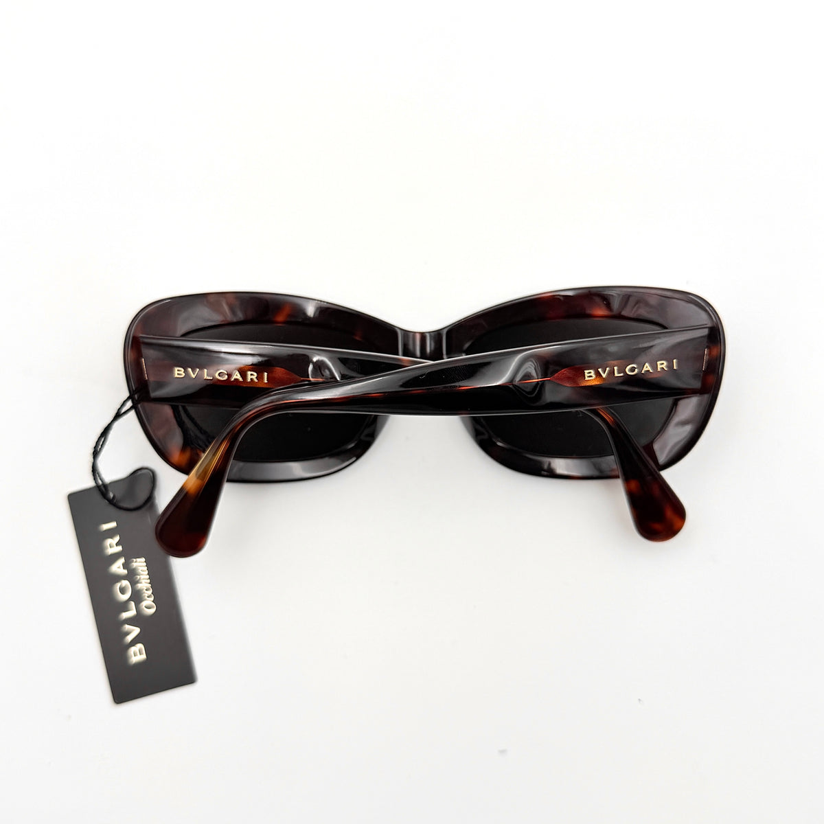Bvlgari 808 sunglasses in tortoiseshell brown acetate displayed with original case and cloth.