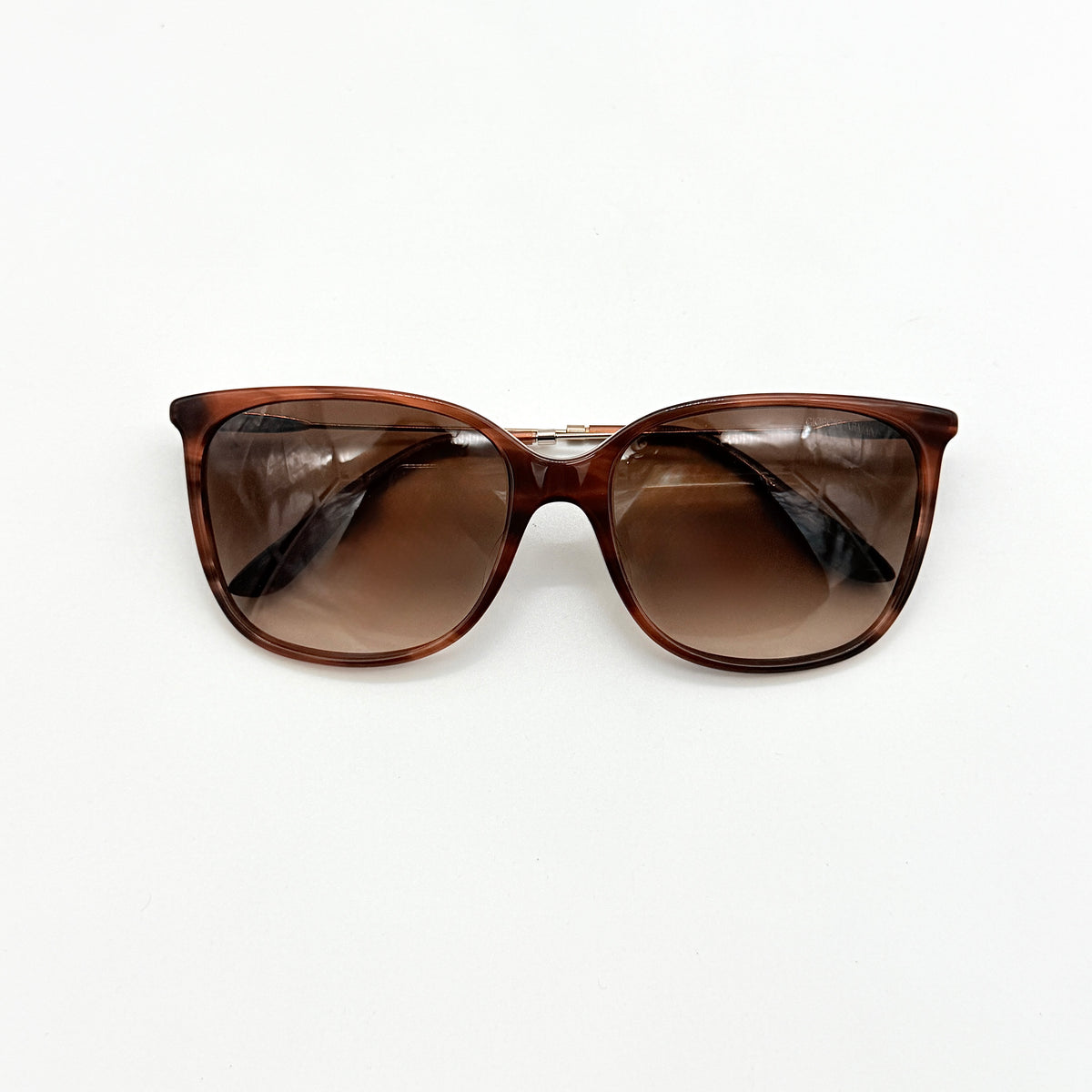 Giorgio Armani AR 8080-F sunglasses in brown tortoise with gradient brown lenses and slim gold-tone arms, displayed at an angle.