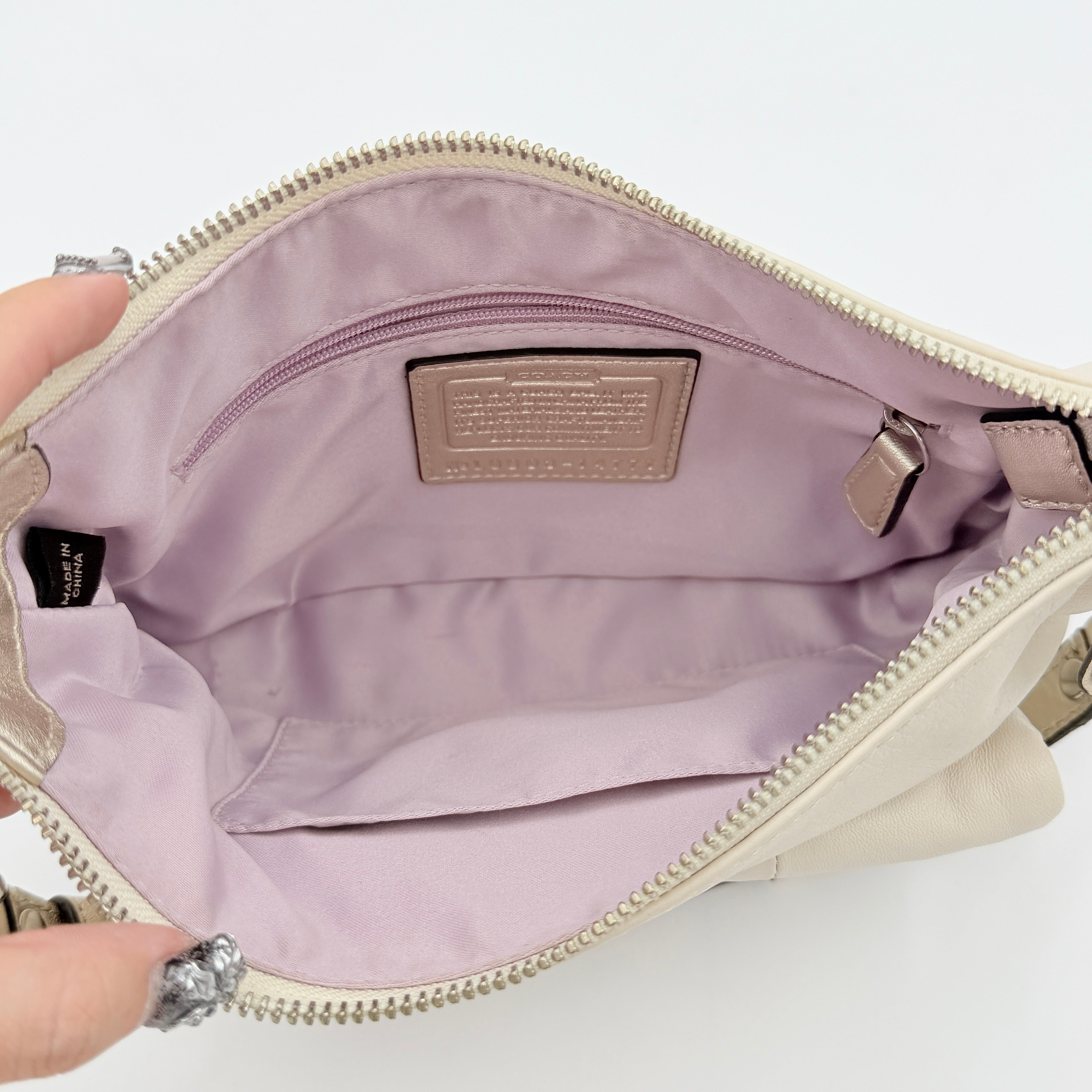 Coach Kristin Hobo Shoulder Bag in ivory leather with silver-tone hardware and a structured short strap.