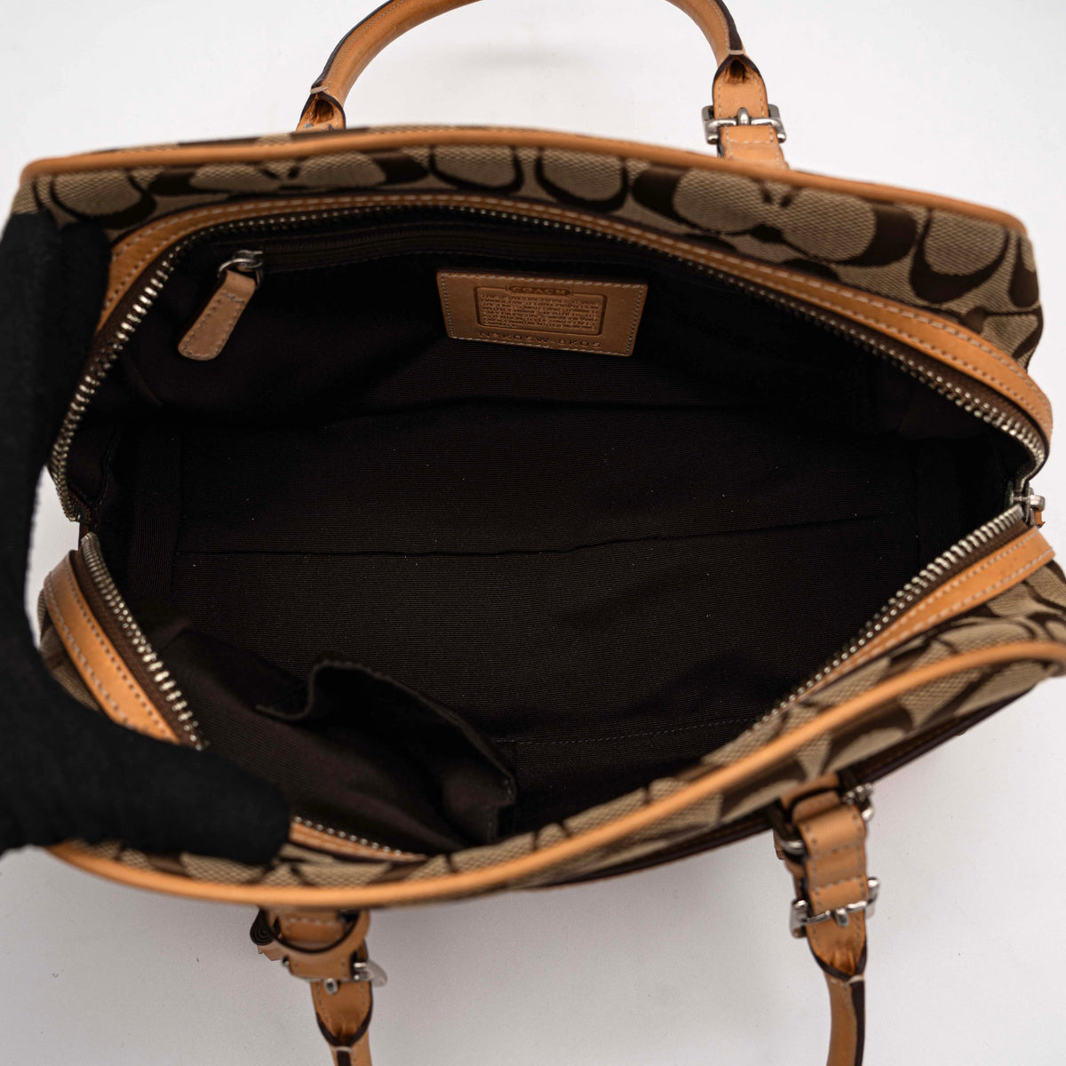 Coach Signature Hampton Satchel Boston Bag in beige and tan canvas with leather trim and silver hardware, styled on a clean background.