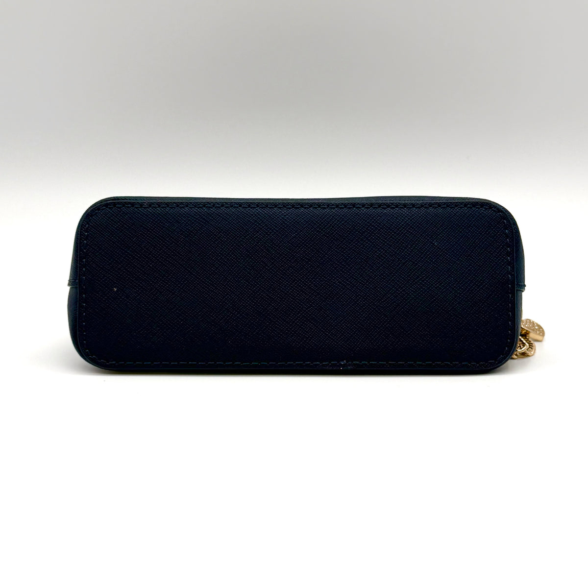 Front view of the Michael Kors black saffiano leather dome cosmetic pouch with gold-tone hardware.