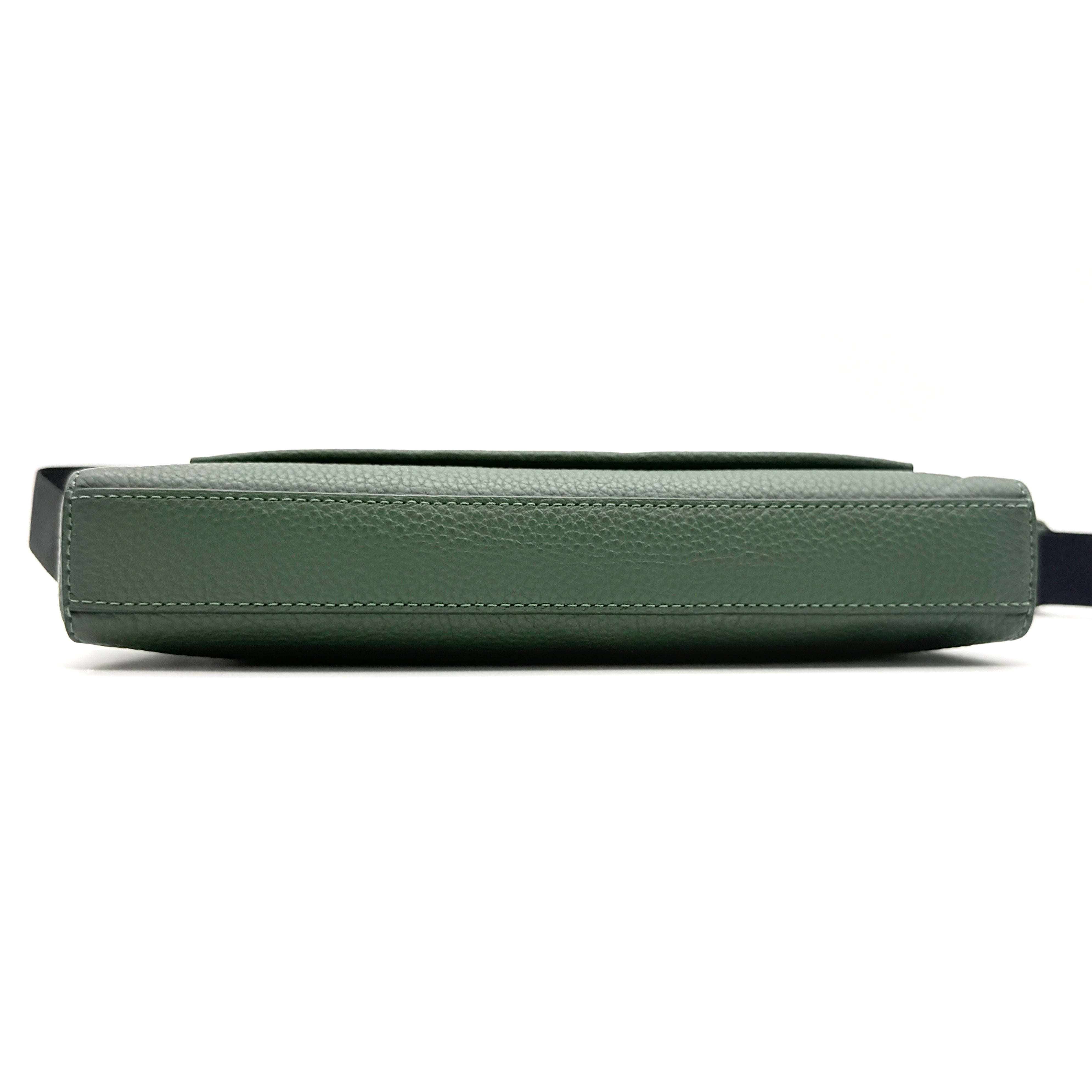 Coach Holden Crossbody bag in dark green pebbled leather with adjustable black webbing strap, displayed against a white background.