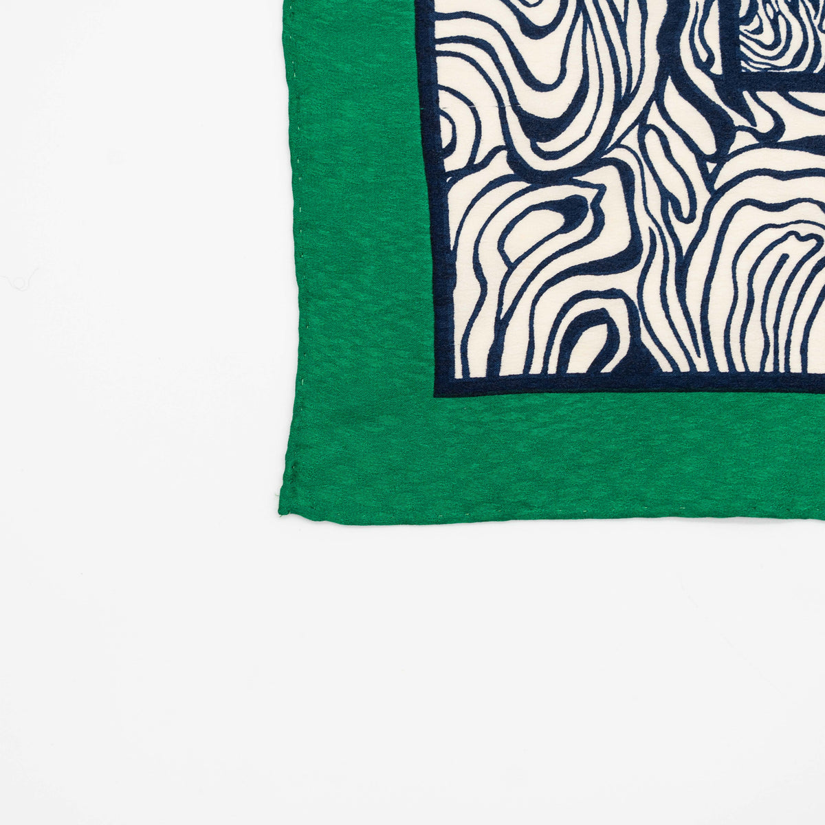 Yves Saint Laurent geometric silk scarf in green and black with abstract and square patterns, featuring a corner YSL label.