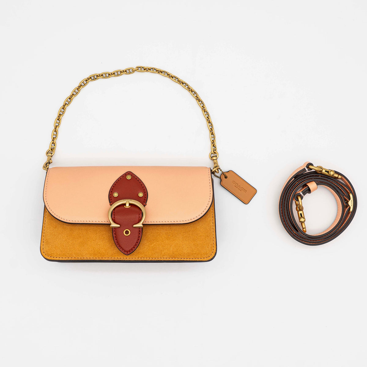 Coach Beat Crossbody Clutch 2Way in blush, tan, and red leather with brass hardware and detachable strap, displayed with chain handle.