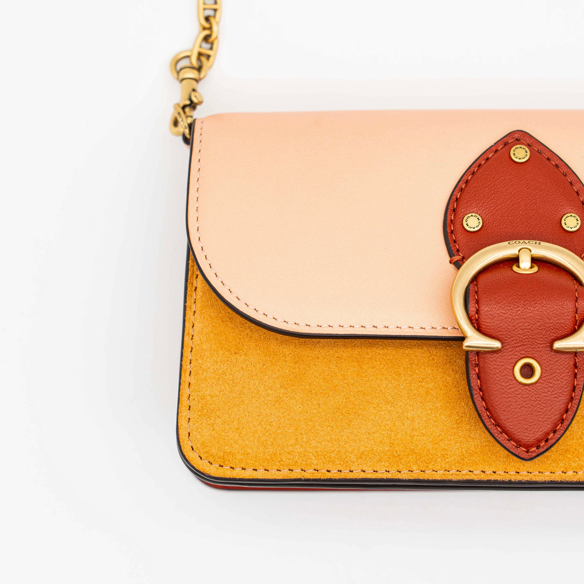 Coach Beat Crossbody Clutch 2Way in blush, tan, and red leather with brass hardware and detachable strap, displayed with chain handle.