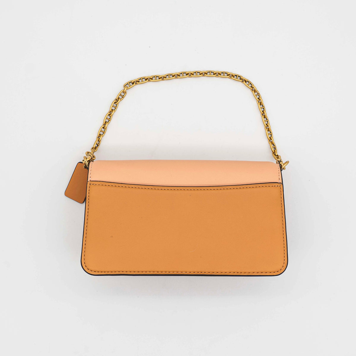 Coach Beat Crossbody Clutch 2Way in blush, tan, and red leather with brass hardware and detachable strap, displayed with chain handle.