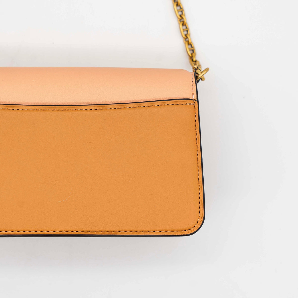 Coach Beat Crossbody Clutch 2Way in blush, tan, and red leather with brass hardware and detachable strap, displayed with chain handle.