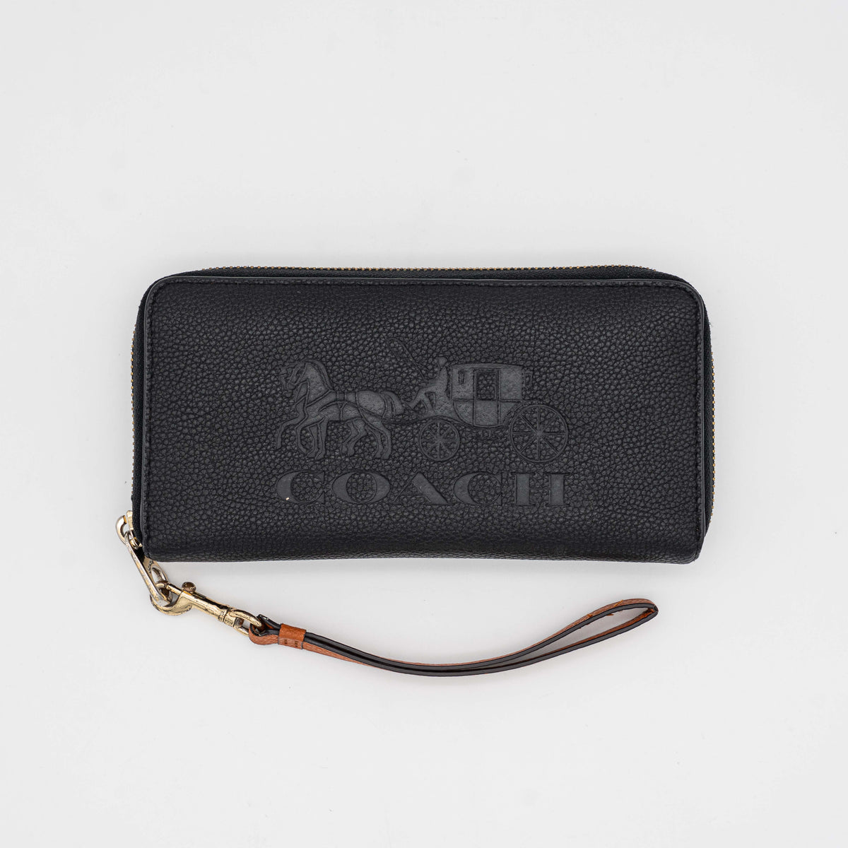 Coach Horse Carriage long zip around wallet in black pebbled leather with wristlet strap, featuring the embossed horse and carriage motif.