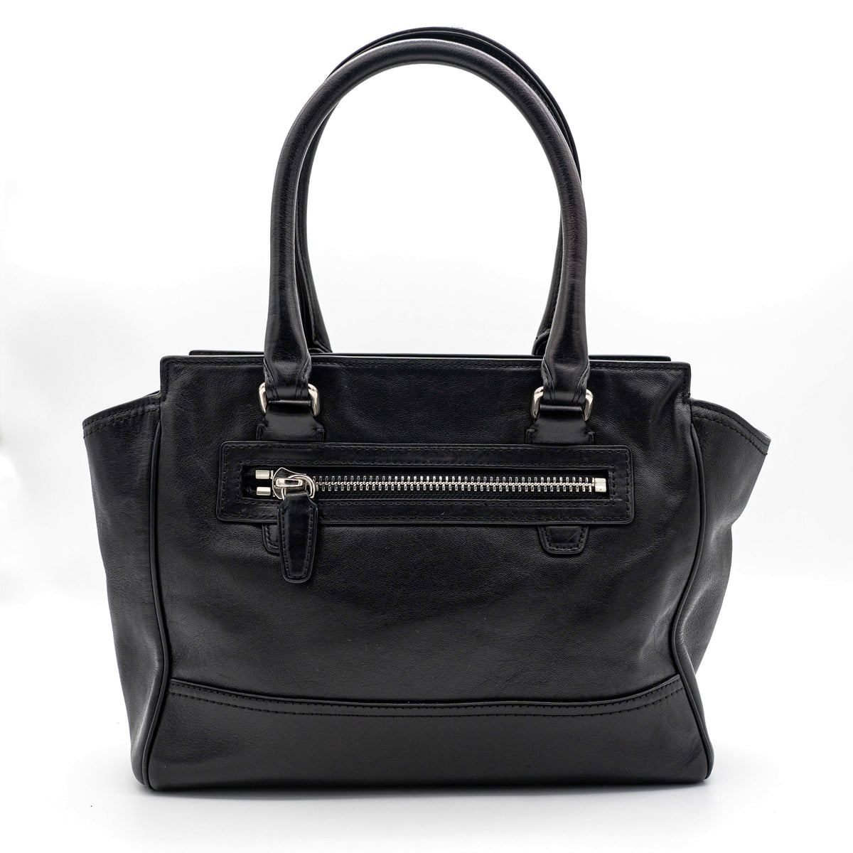 Coach Legacy Candace Carryall in black leather with double tassel charm and silver hardware, photographed against a white background.