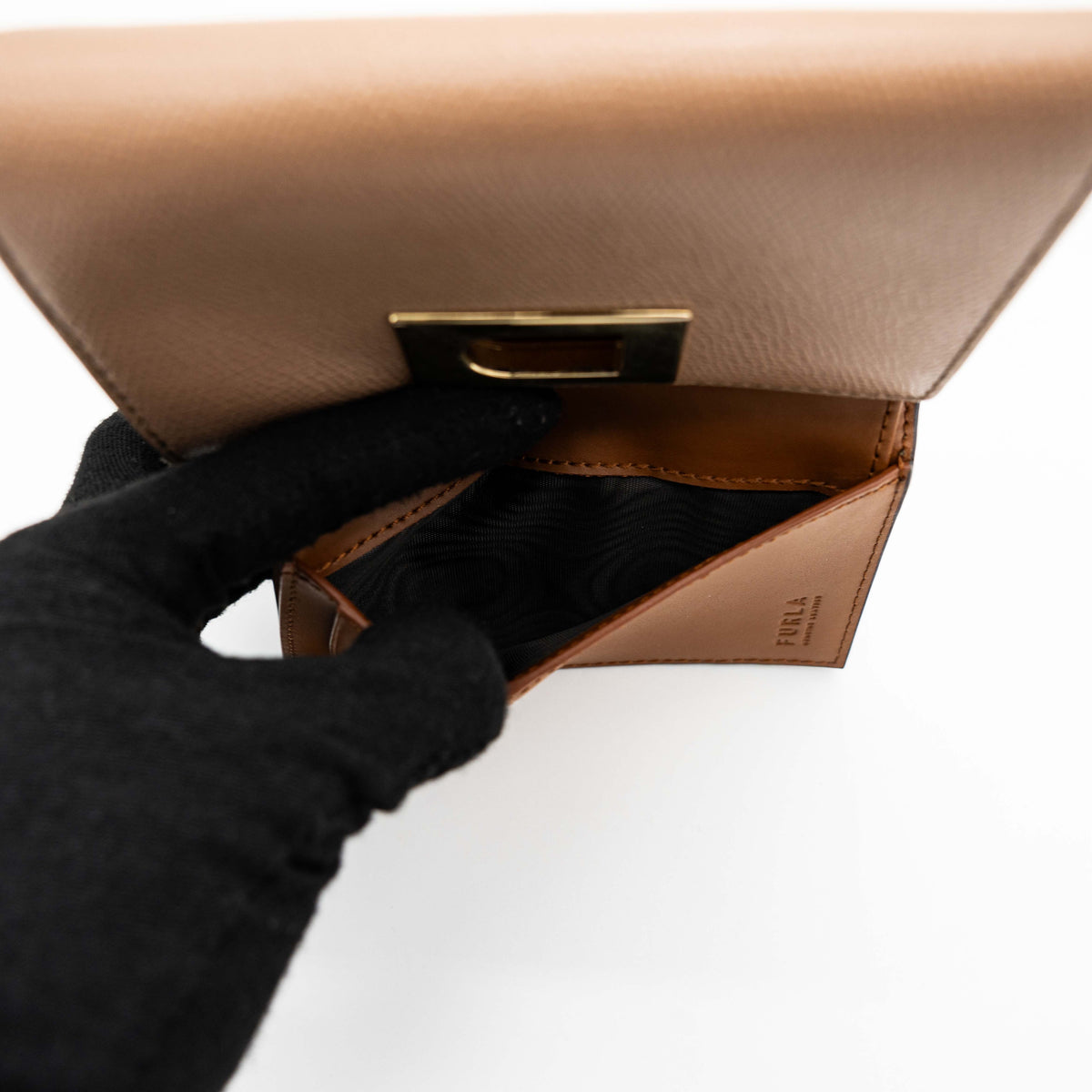 Furla 1927 M Compact Wallet in brown and black leather with gold hardware, photographed front facing on a white background.