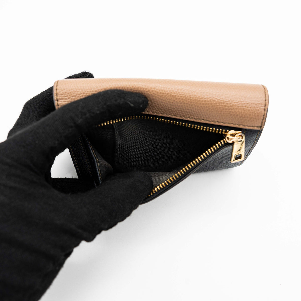 Furla 1927 M Compact Wallet in brown and black leather with gold hardware, photographed front facing on a white background.