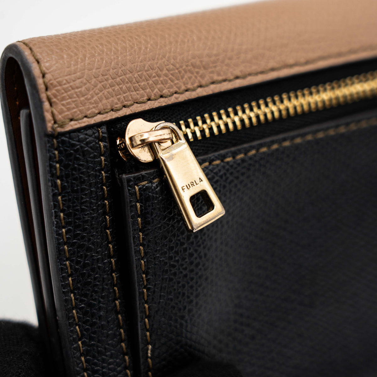 Furla 1927 M Compact Wallet in brown and black leather with gold hardware, photographed front facing on a white background.