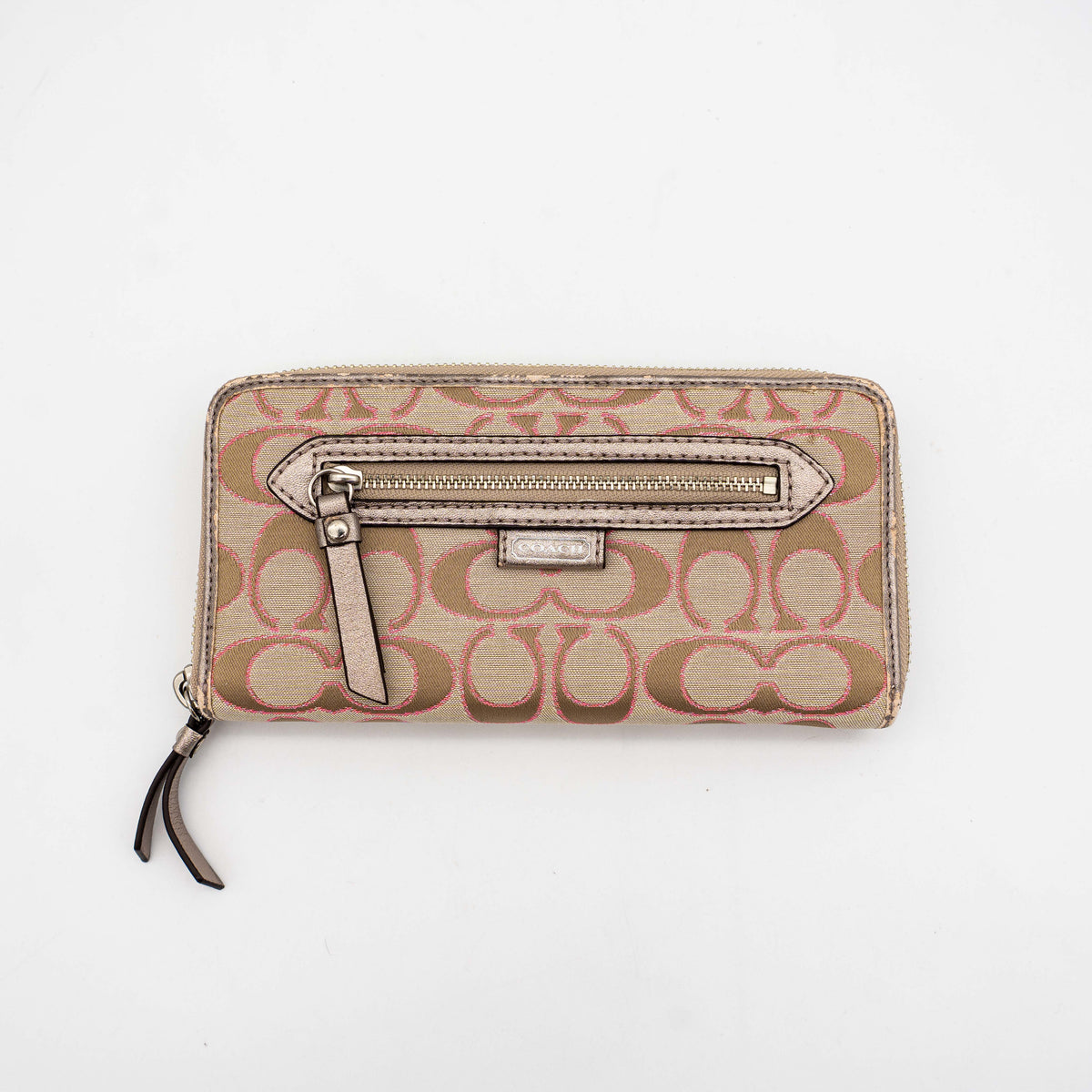 Coach Signature Daisy Accordion Zip Wallet in beige and pink canvas with zip pocket and metallic trim, photographed on a white background.