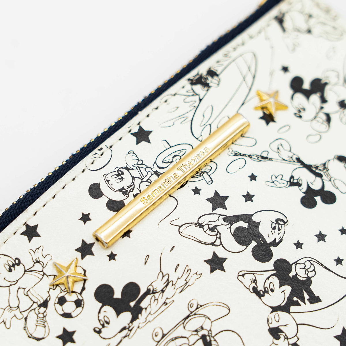 Samantha Thavasa Sports Mickey Collection card case in ivory and blue with gold chain and playful Mickey Mouse sports illustrations.