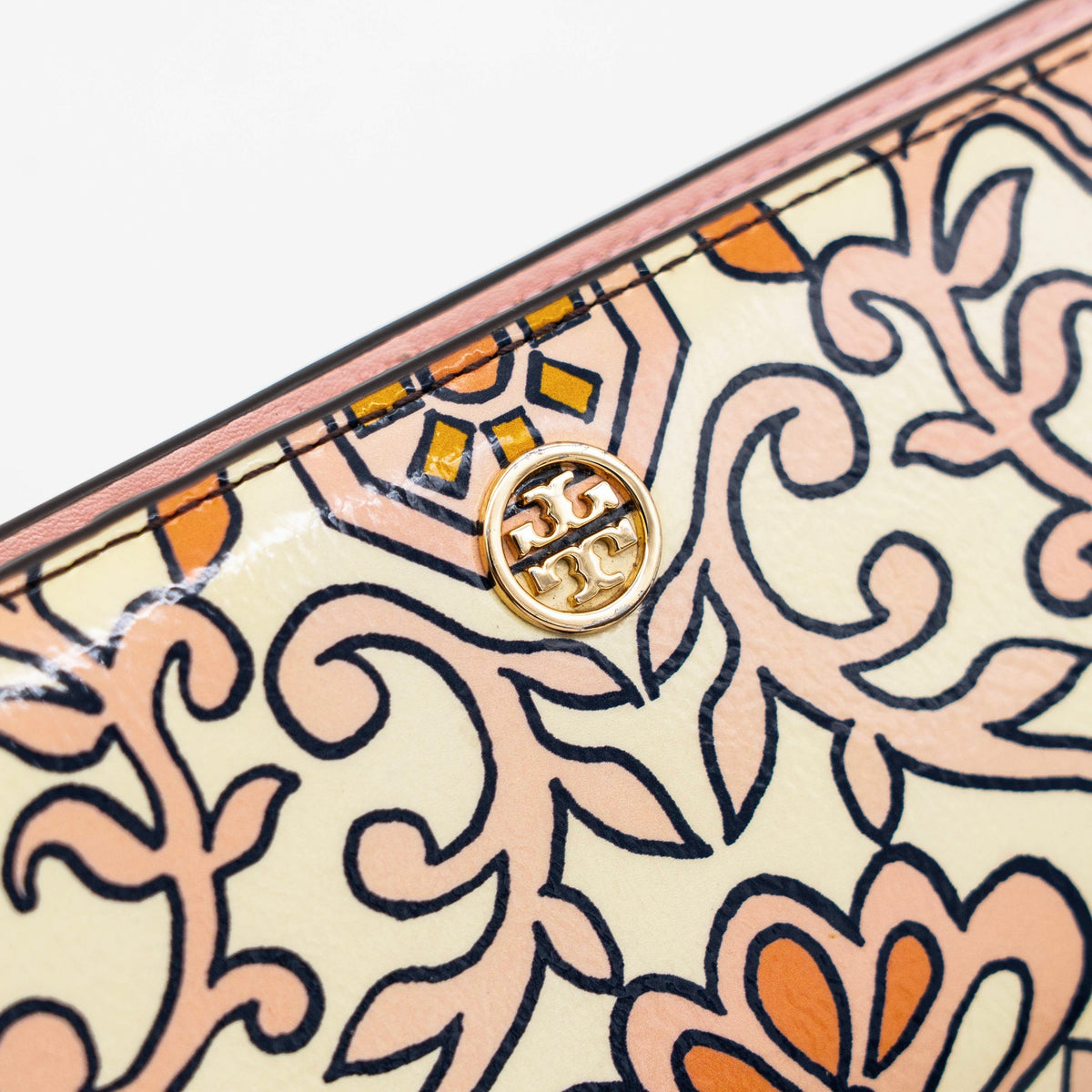 The Tory Burch Hicks Garden Party Wallet in multi-colour coated canvas with intricate floral print and gold logo detail.