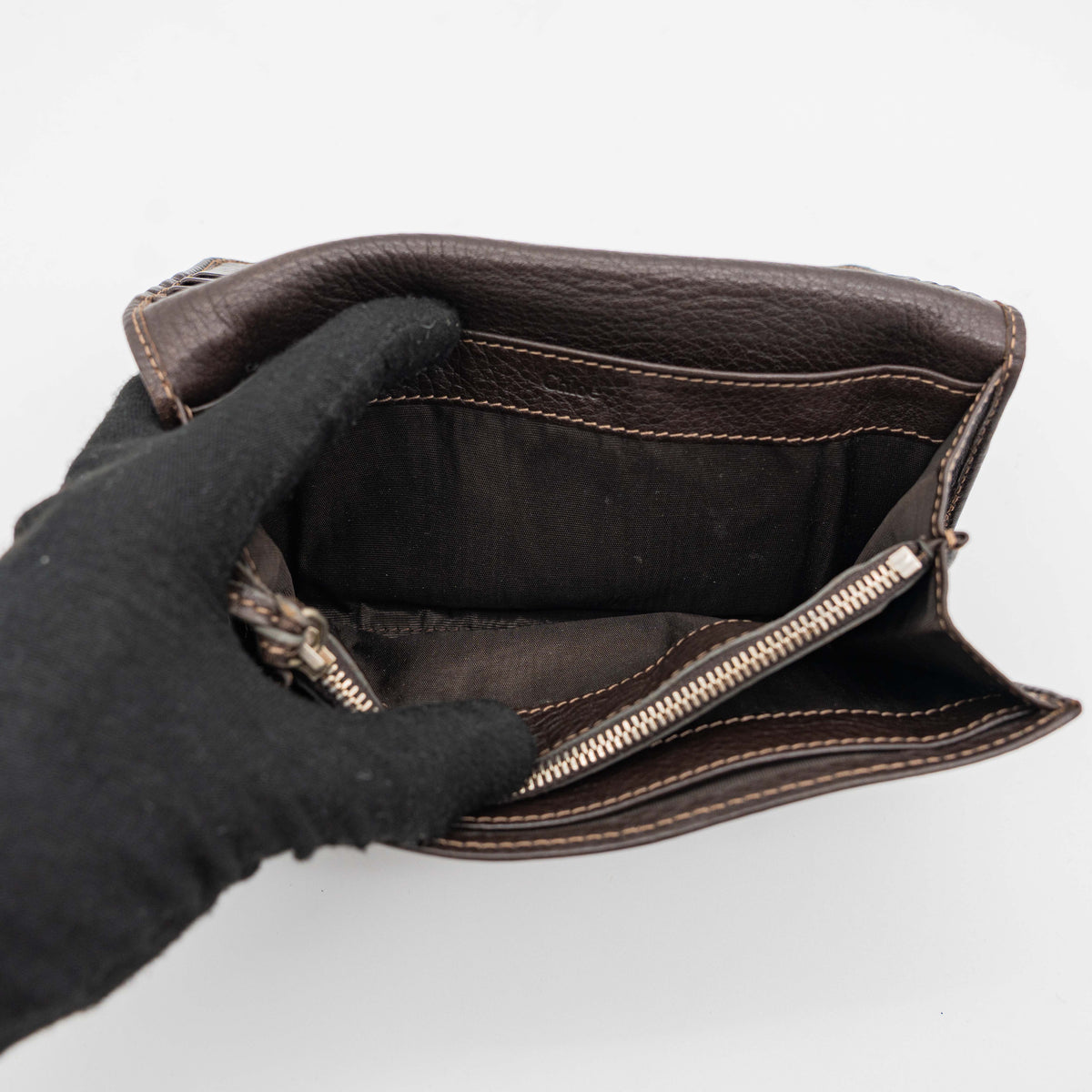 Chloé Paddington long wallet in dark brown leather with signature gold-tone padlock on the front.