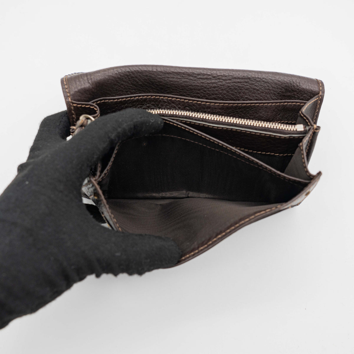 Chloé Paddington long wallet in dark brown leather with signature gold-tone padlock on the front.