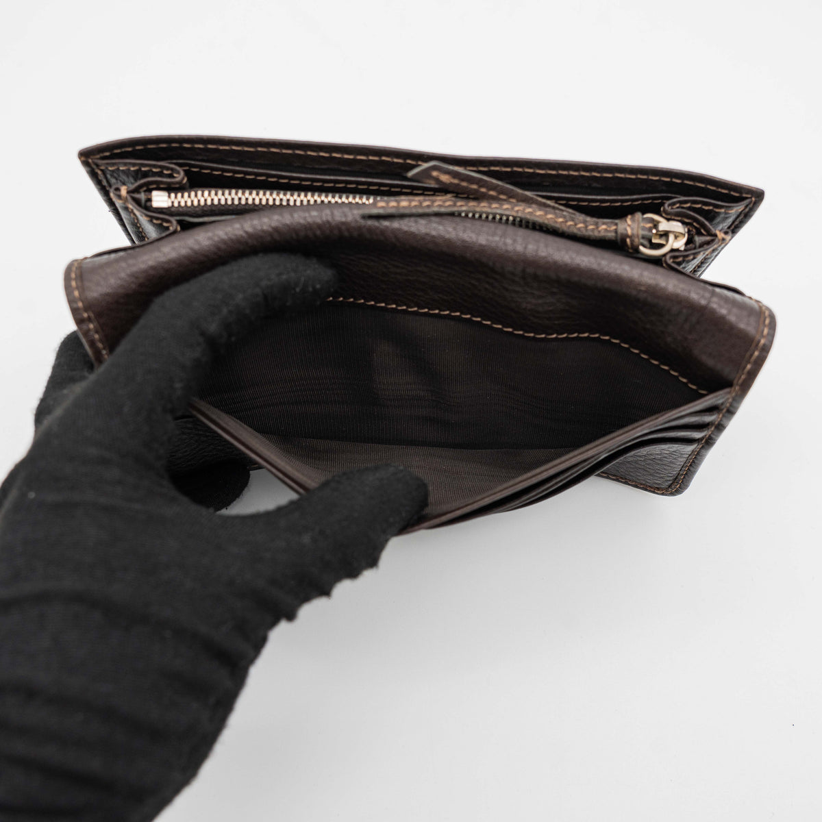 Chloé Paddington long wallet in dark brown leather with signature gold-tone padlock on the front.
